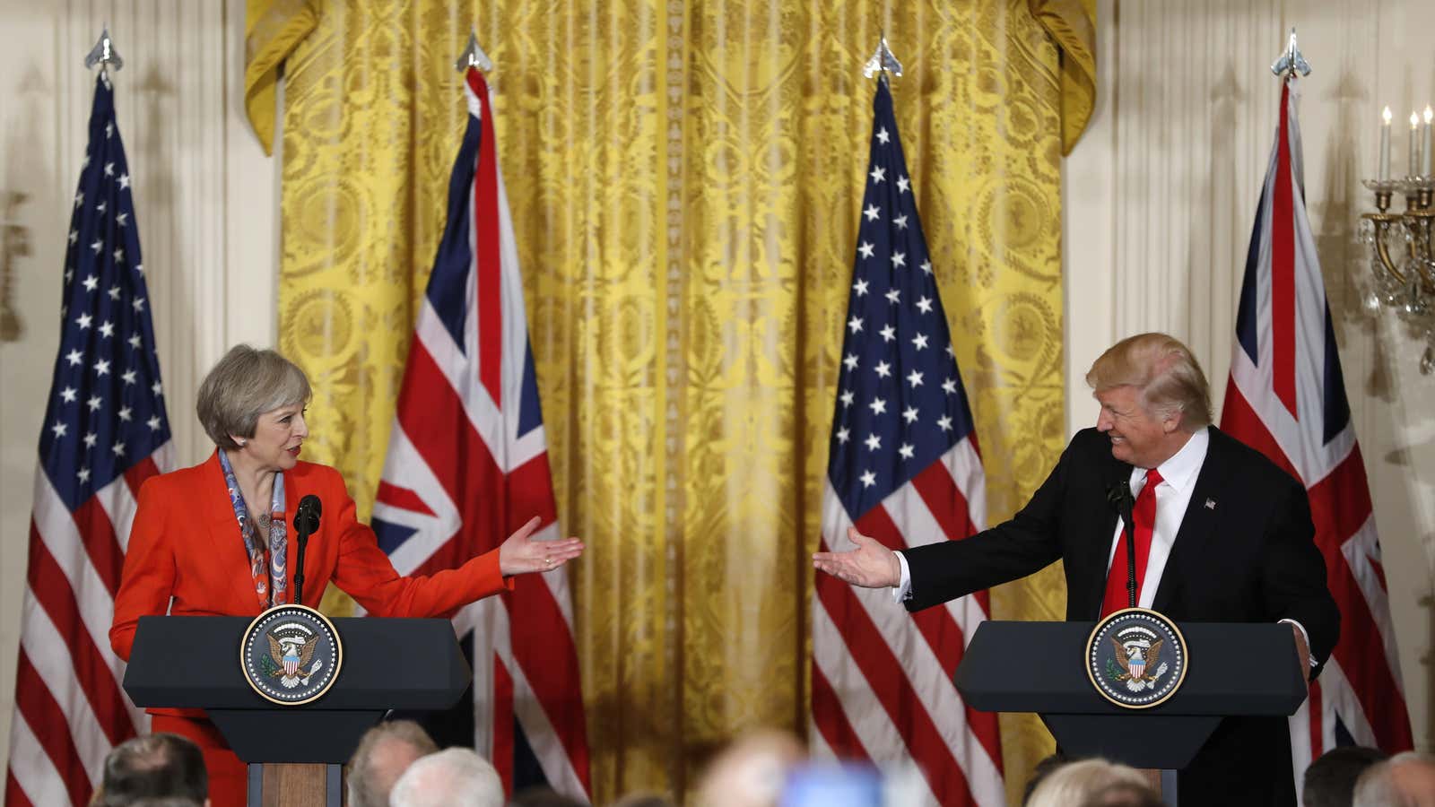 President Donald Trump and British Prime Minister Theresa May participate in a news conference in the East Room of the White House in Washington. (AP…