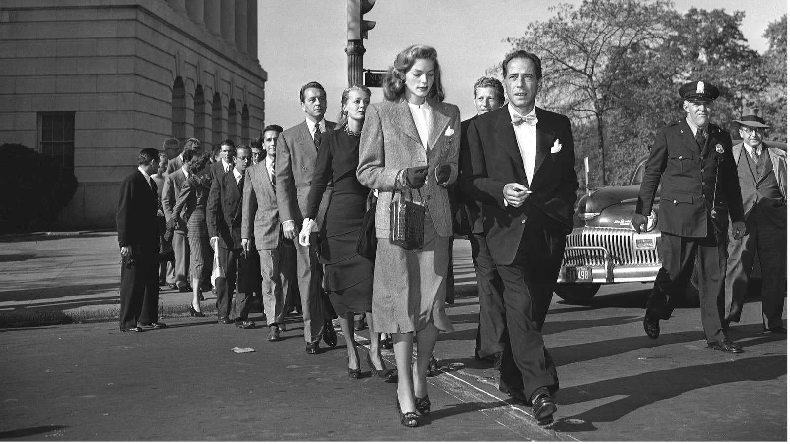 Lauren Bacall and Humphrey Bogart lead the way to the US Capitol in 1947.