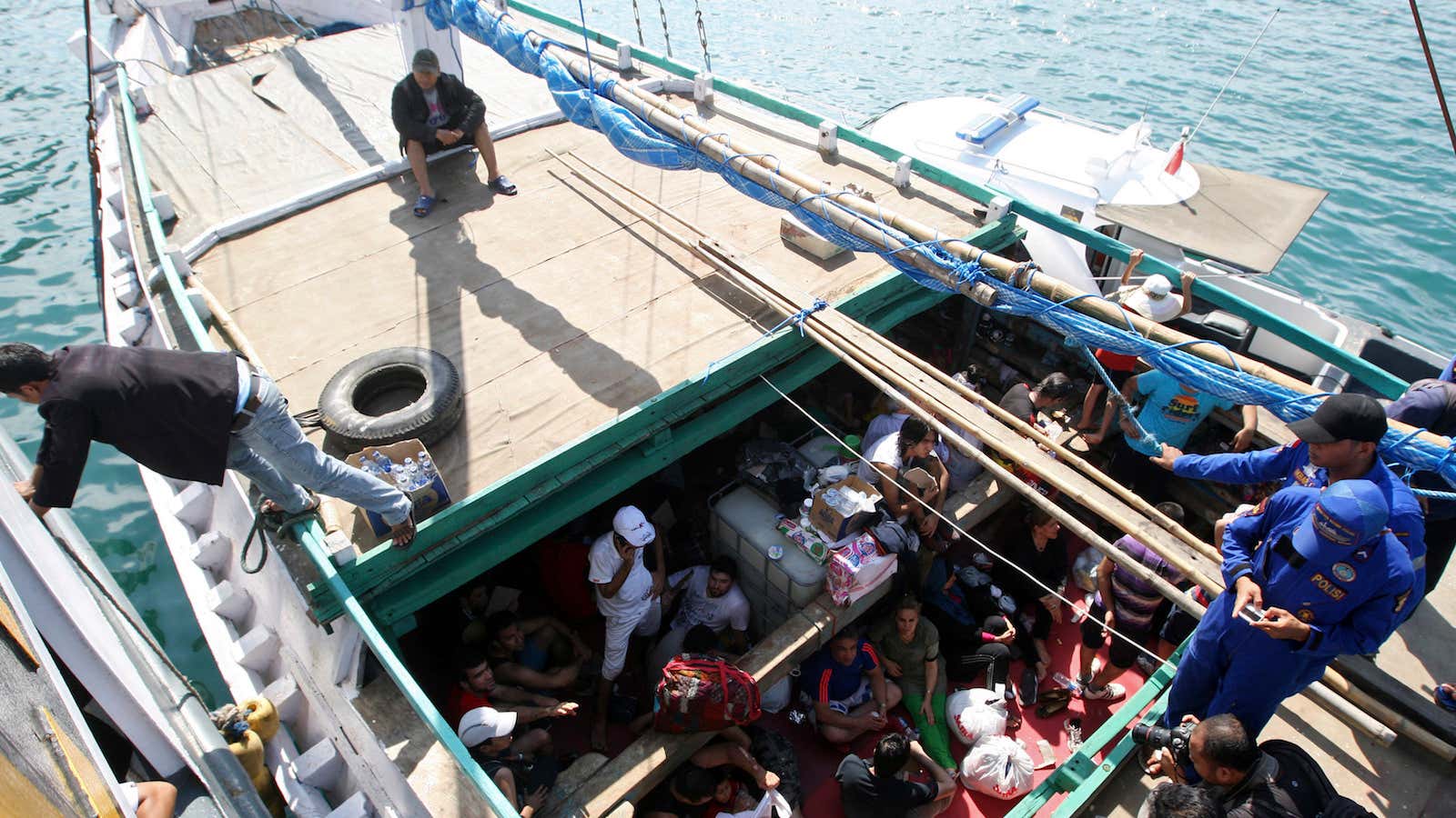 A boat carrying Iranian asylum seekers is intercepted in Indonesian waters en route to Australia.