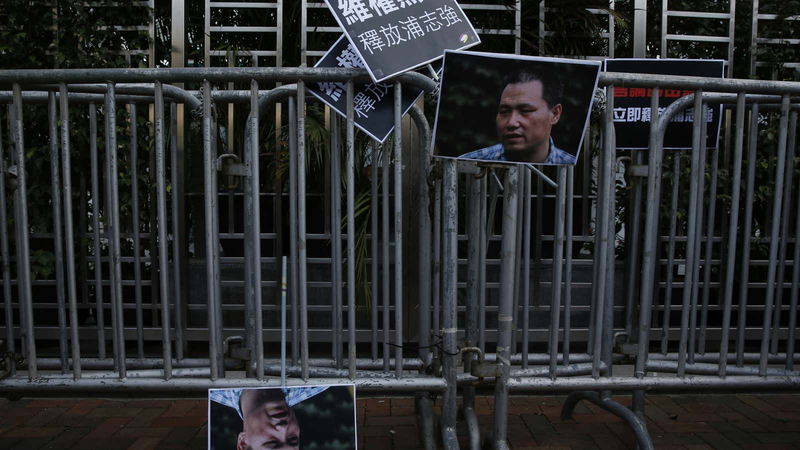 Pictures of Pu Zhiqiang displayed by protesters in Hong Kong.