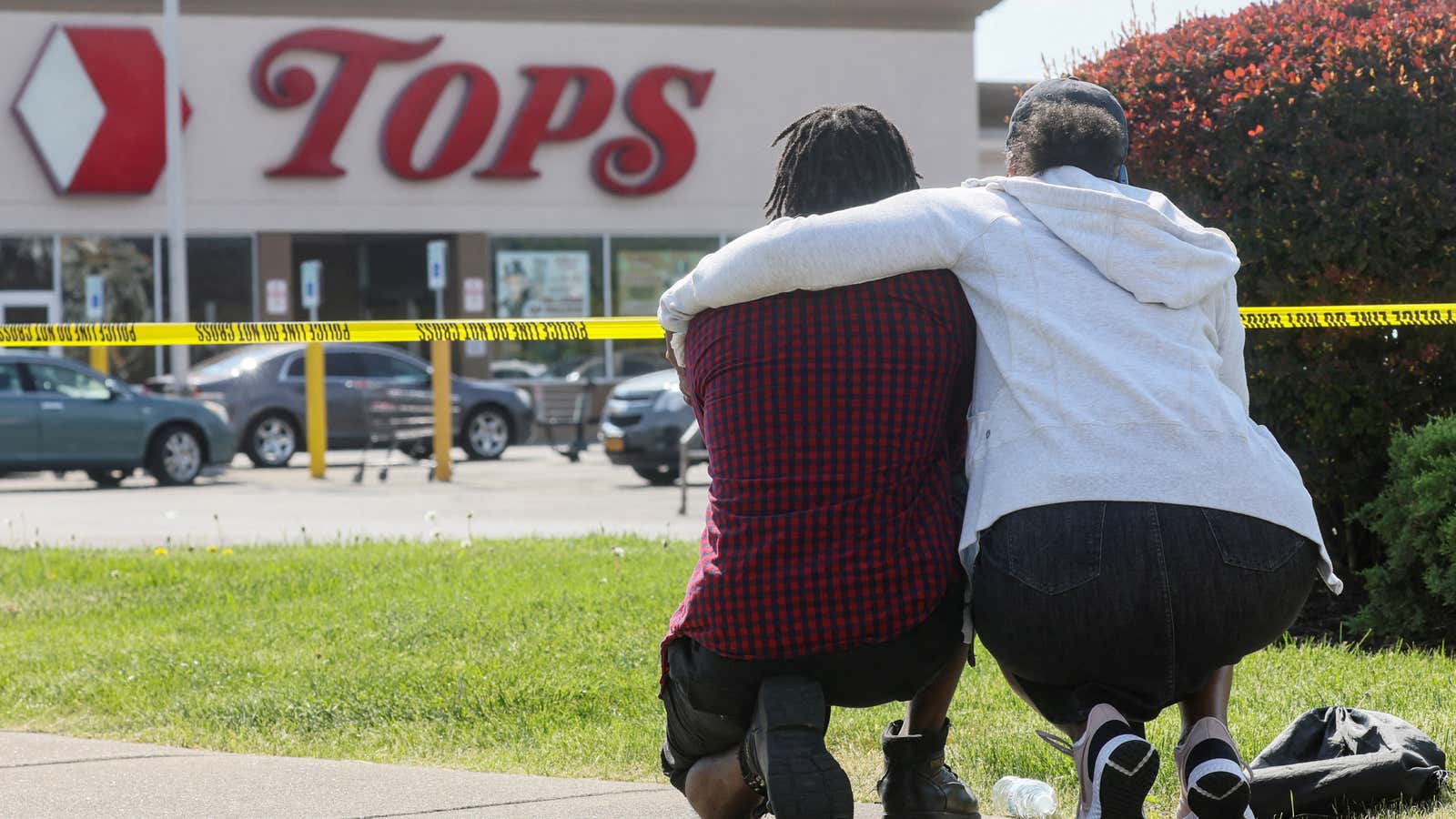 Mourners attend a vigil for victims of a racist shooting at a Buffalo supermarket.