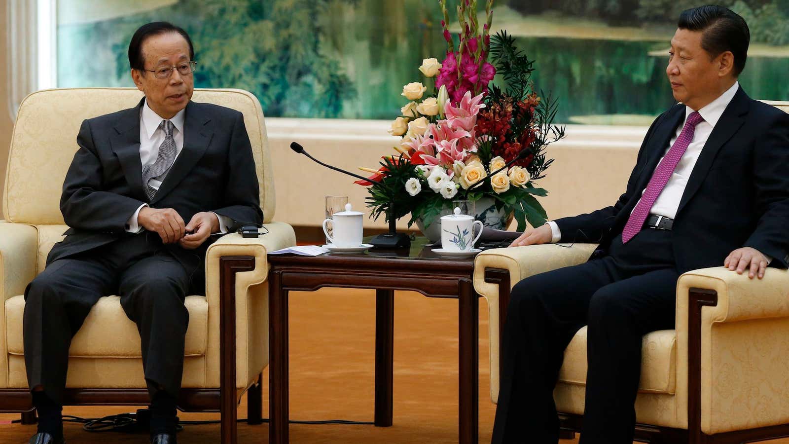 Not quite chums: Chinese president Xi Jinping (right) and former Japanese prime minister Yasuo Fukuda in Beijing.