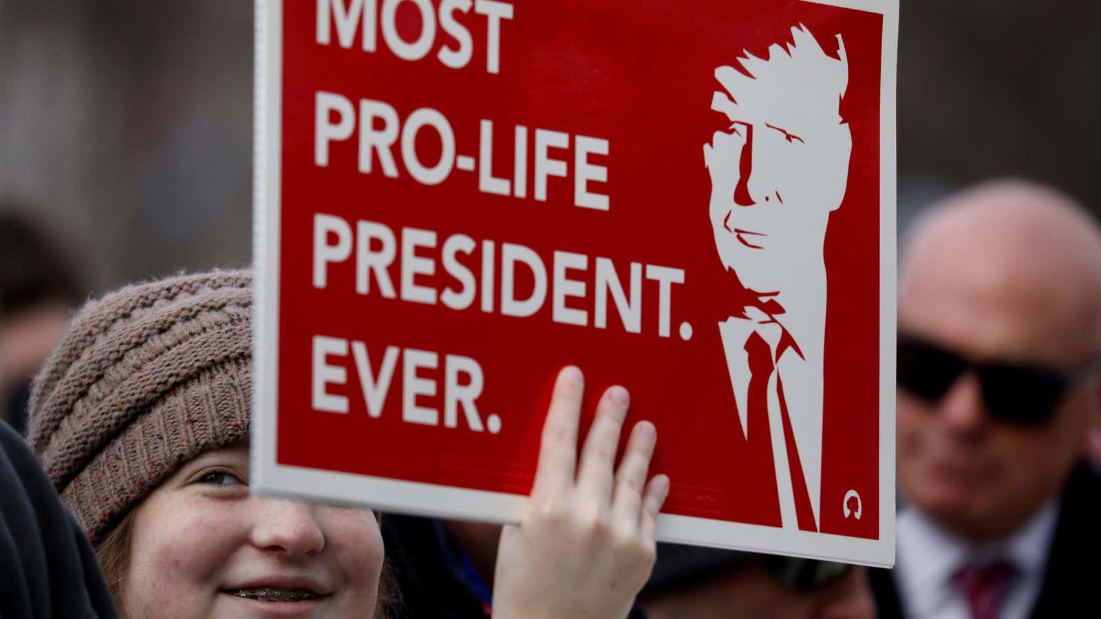 An anti-abortion marcher holds a sign about US President Donald Trump in Washington DC Jan. 24, 2020.