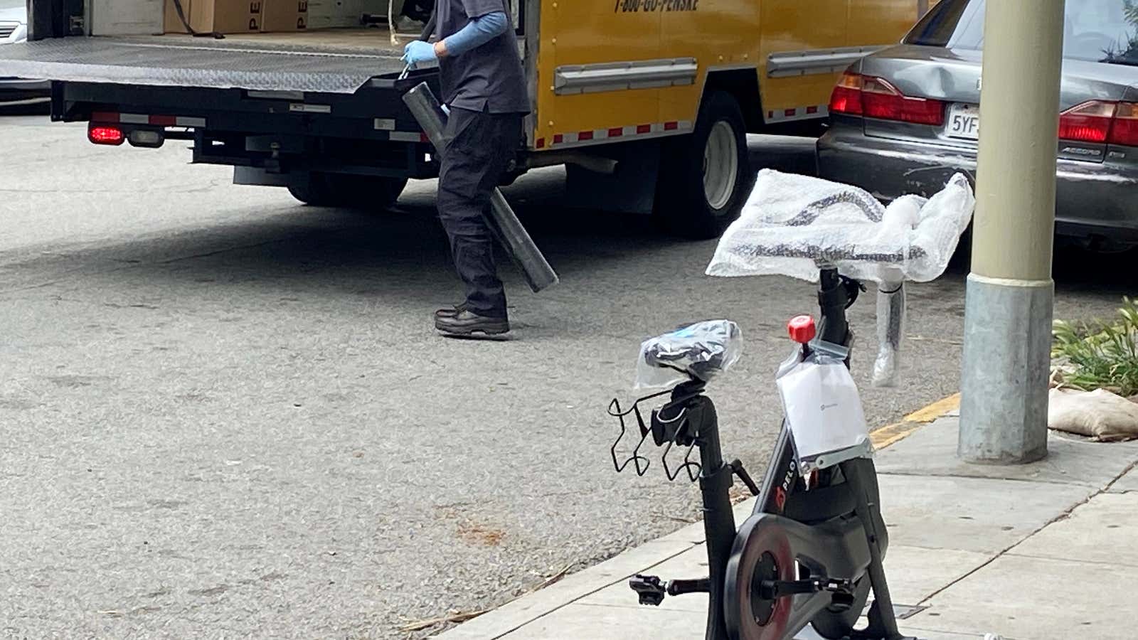 A Peloton indoor exercise bicycle is delivered to a customer during the coronavirus lockdown in San Francisco.