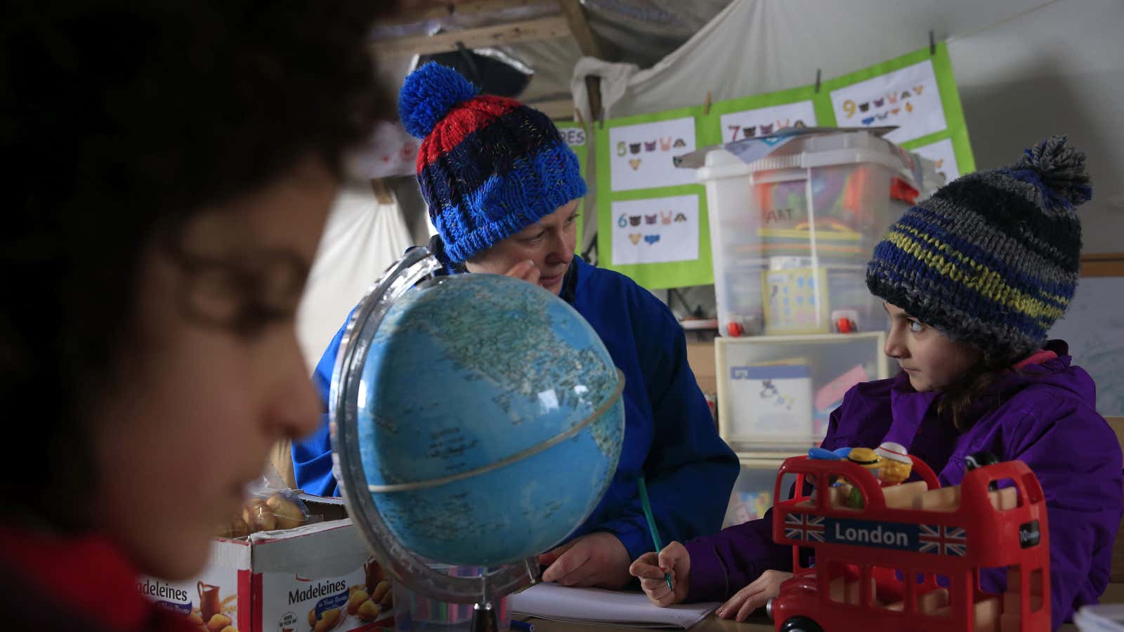 A volunteer with  a young Kurdish girl.