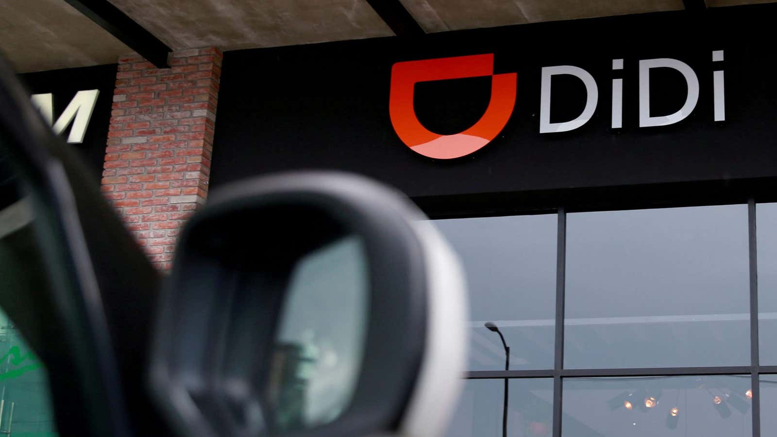 The logo of Chinese ride-hailing firm Didi Chuxing is seen at their new drivers center in Toluca, Mexico, April 23, 2018.