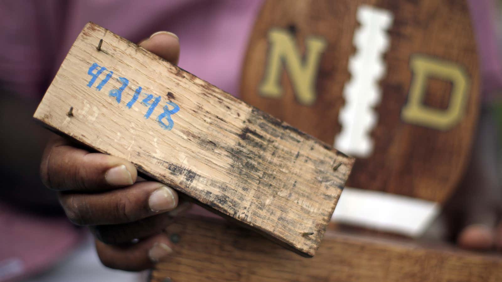 A former inmate holding a product he made while in prison. The number refers to a section of Tennessee code that makes it illegal for jail officials to require an inmate to perform labor that results in the official’s personal gain.