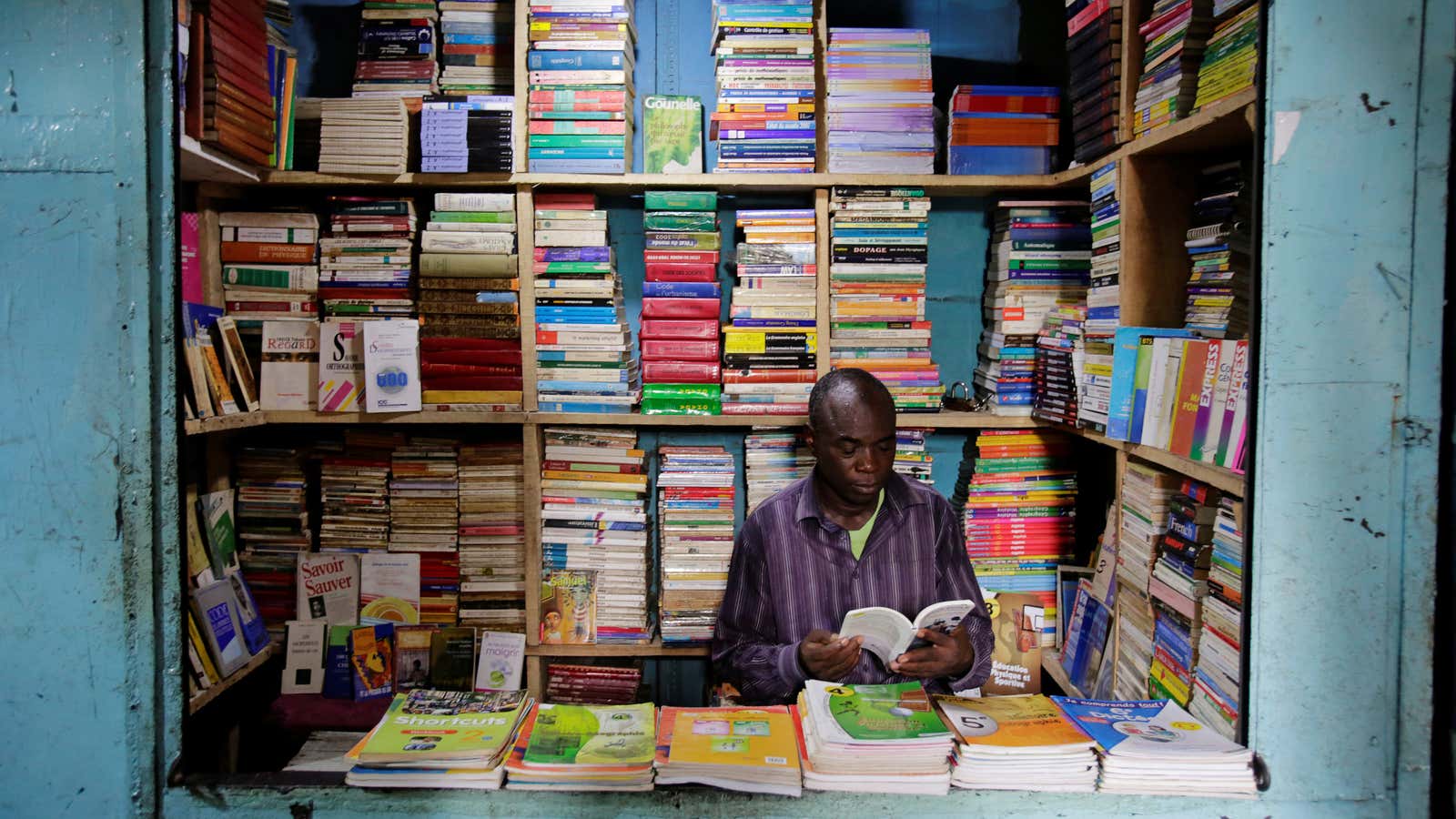 A school book seller is seen at Adjame market in Abidjan, Ivory Coast, September 13, 2018. Picture taken September 13, 2018.