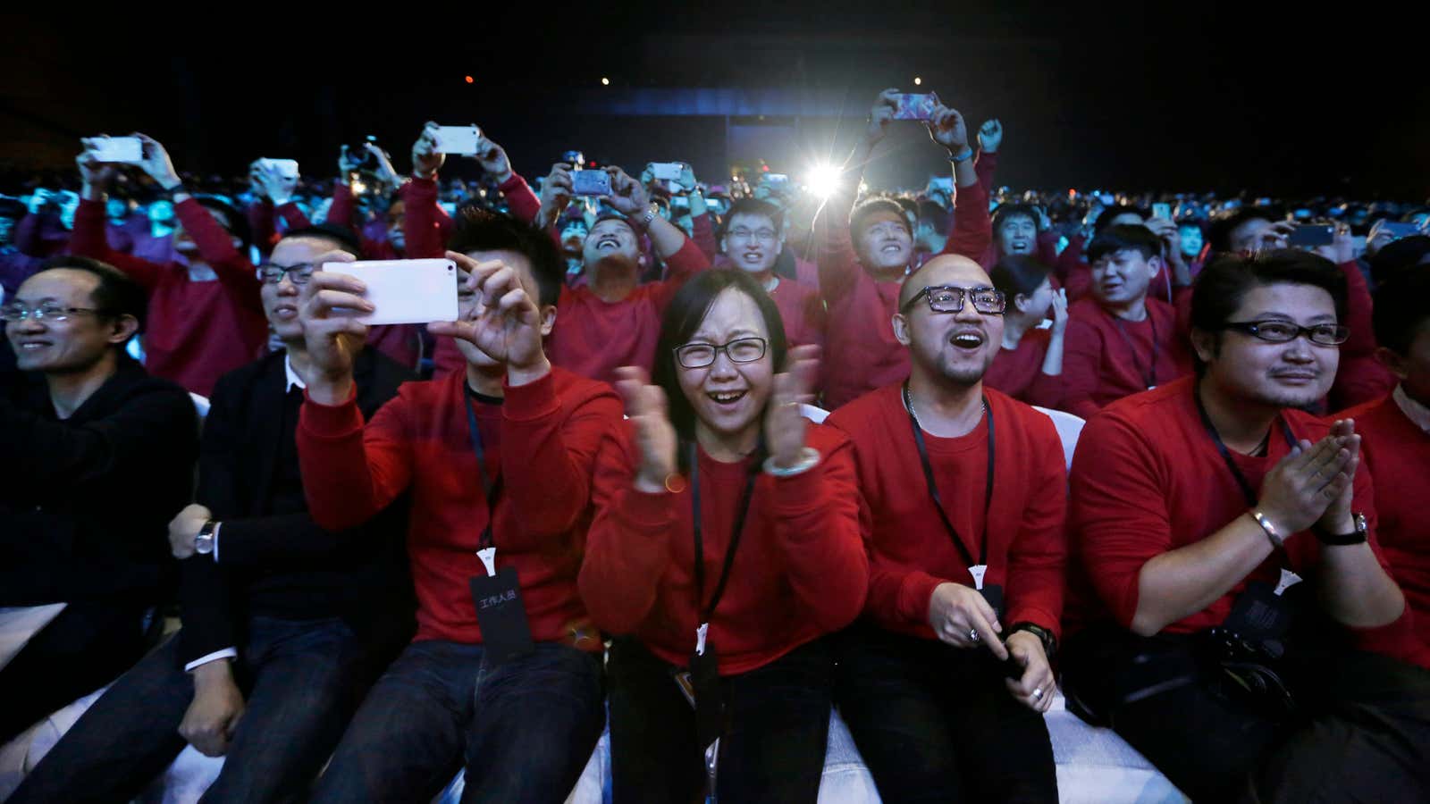 Xiaomi staff and users celebrate the launch of the Mi Note in Beijing in 2015.