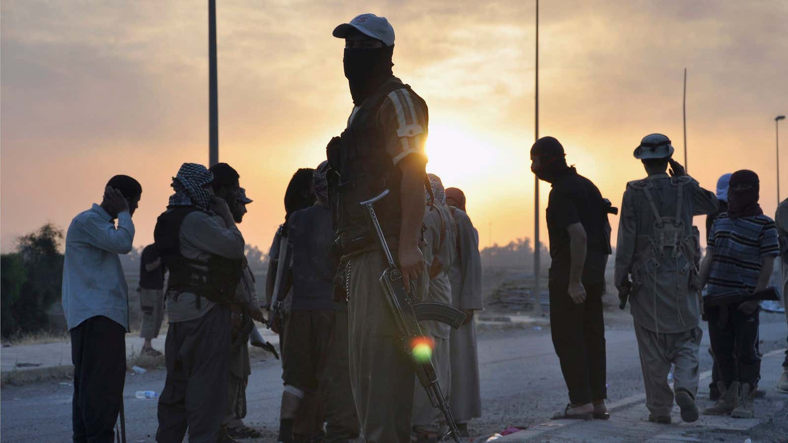 Fighters of ISIL… or ISIS… or whatever… stand guard at a checkpoint in the northern Iraq city of Mosul.