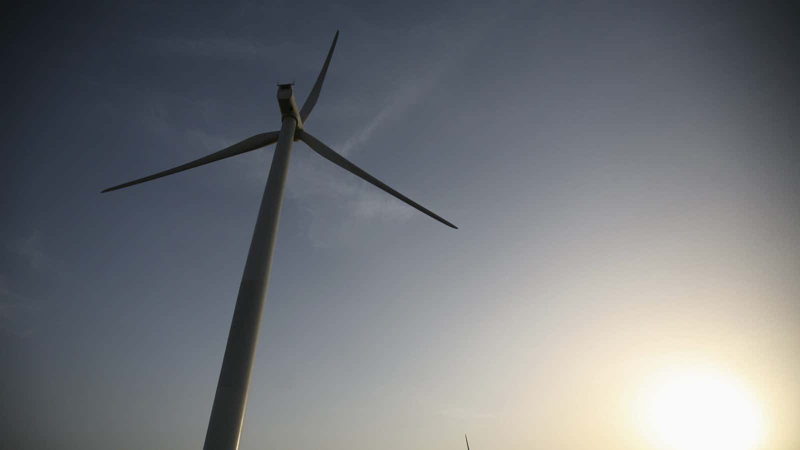 Power generating windmill turbines are pictured during the inauguration ceremony of the new 25 MW ReNew Power wind farm at Kalasar village in the western…