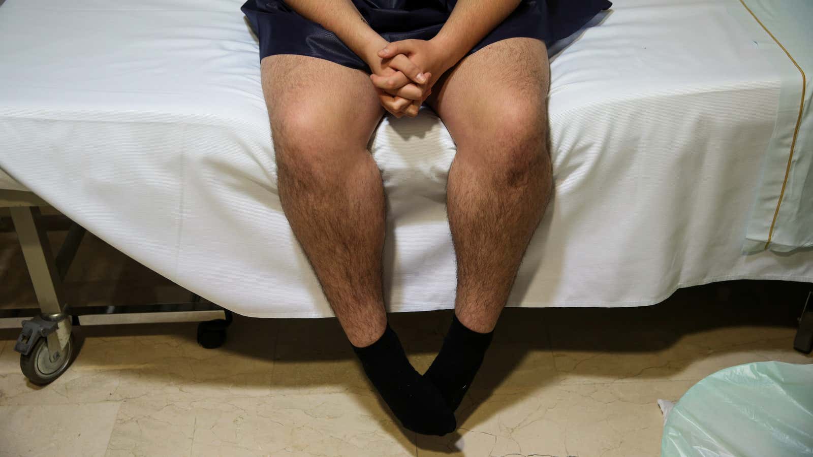 Transgender teenager Gabriel Diaz de Tudanca, 18, waits to be taken to the operating room to have his female to male chest reconstruction surgery in…