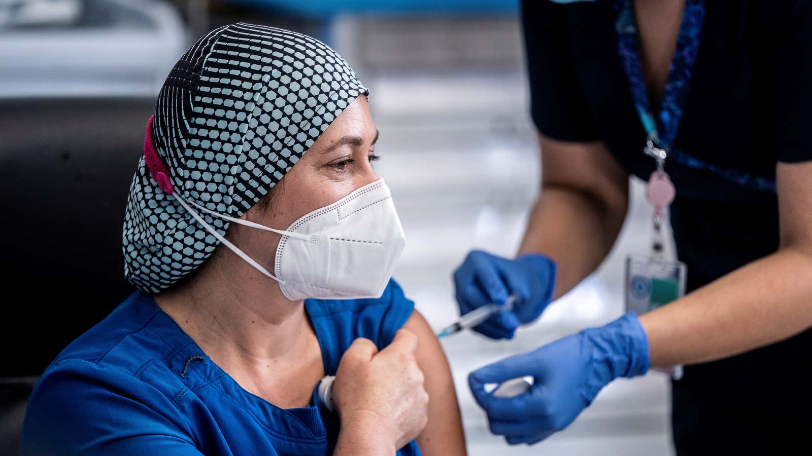 Health worker Zulema Riquelme receives the first injection with a dose of the Pfizer/BioNtech COVID-19 vaccine at Metropolitano Hospital, as the coronavirus disease (COVID-19) outbreak…