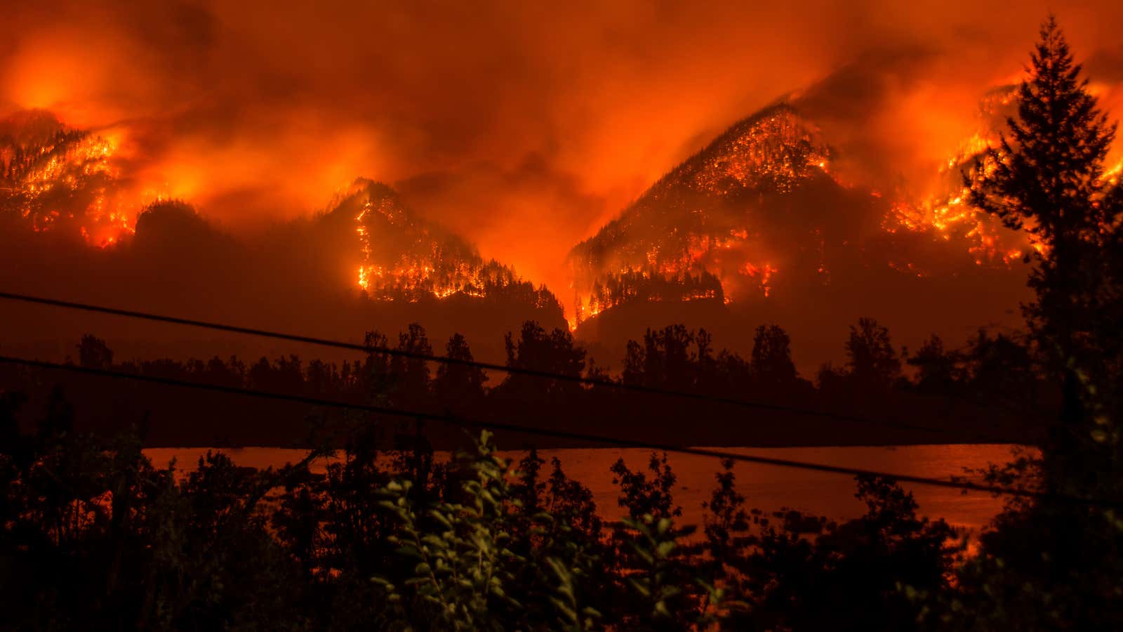 A wildfire as seen from near Stevenson, Washington, across the Columbia River, burning in the Columbia River Gorge.