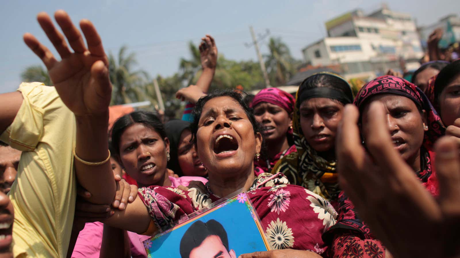 Relatives of victims killed in the collapse of Rana Plaza mourn the dead.