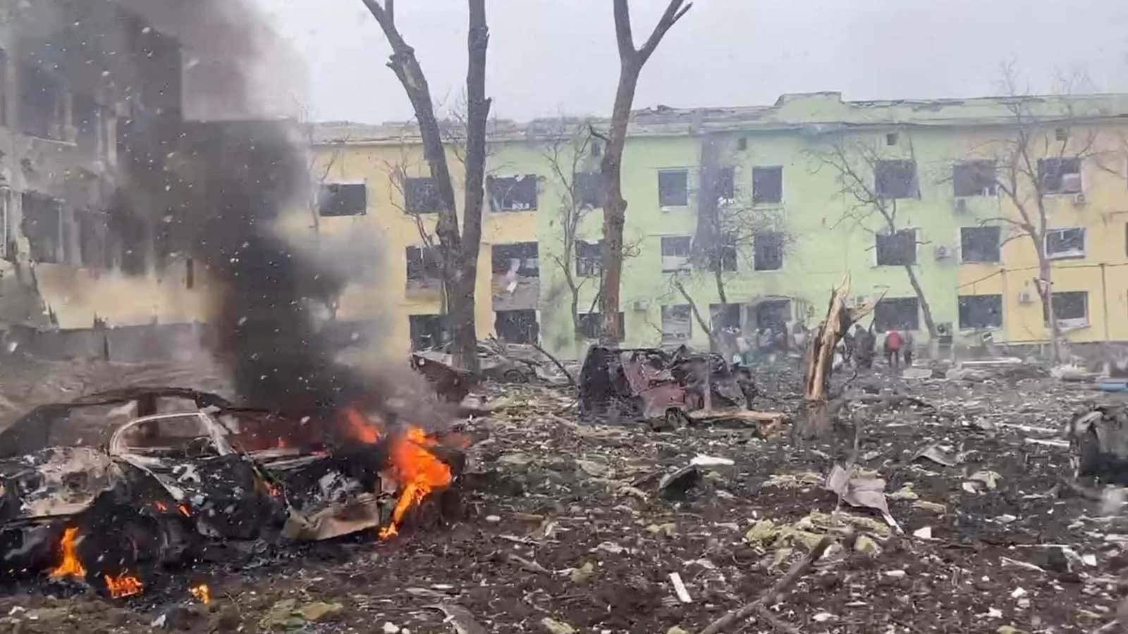 A view shows cars and a building of a hospital destroyed by an aviation strike amid Russia’s invasion of Ukraine, in Mariupol, Ukraine.