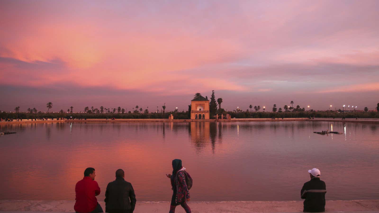 Sunset at the historic Menara garden in Marrakech, Morocco,