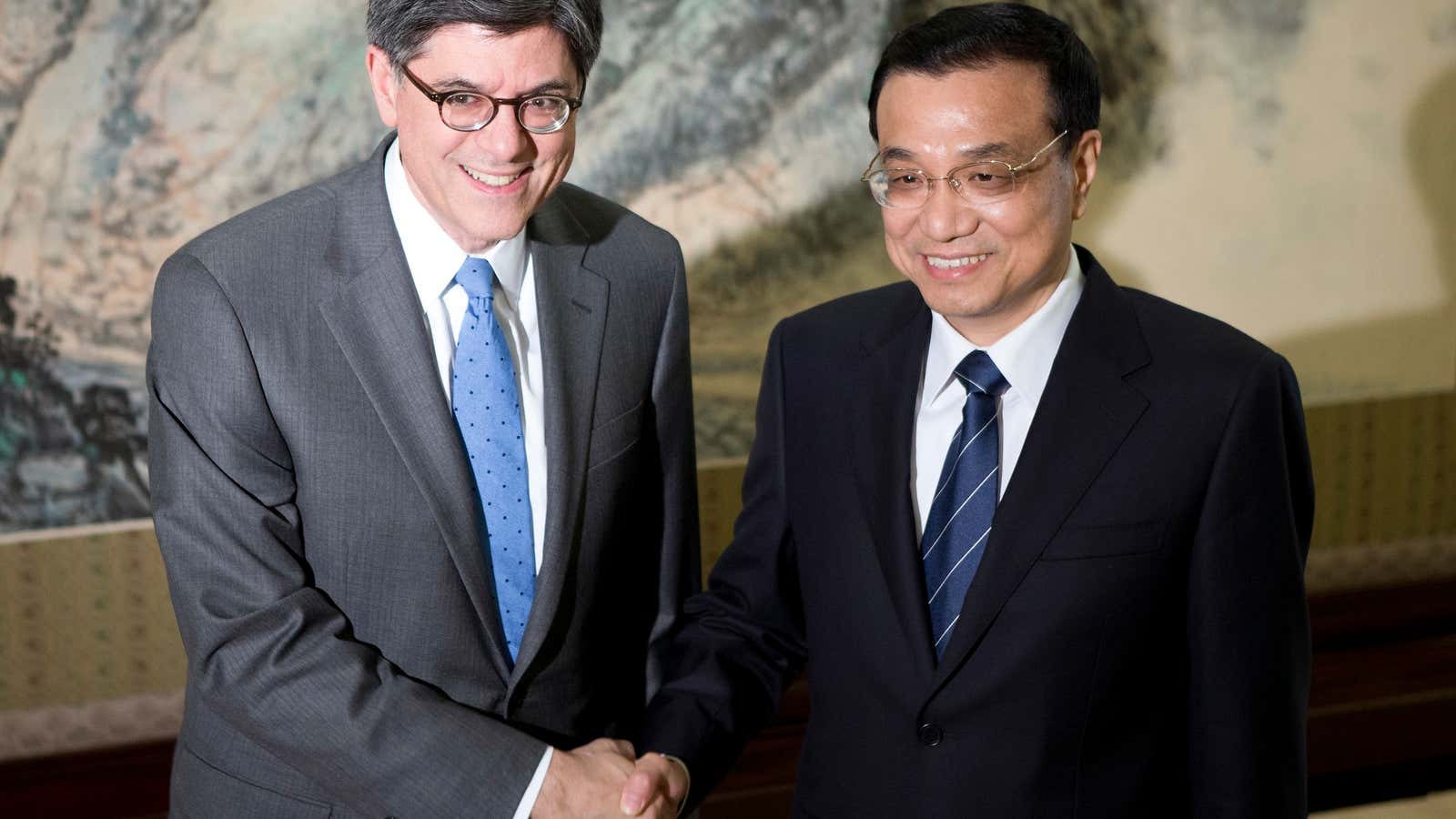 Behind the grin US Treasury Secretary Jacob Lew, pictured here with Chinese Premier Li Keqiang, has been pressing Beijing on the issue of computer hacking.