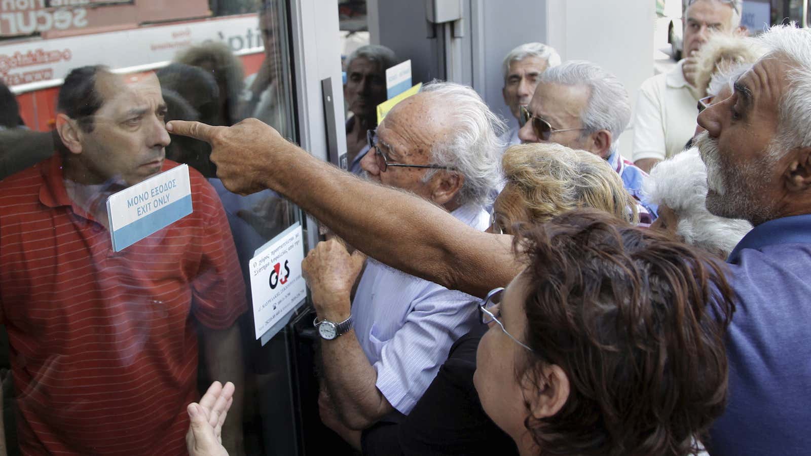 Pensioners waiting outside a closed National Bank branch.