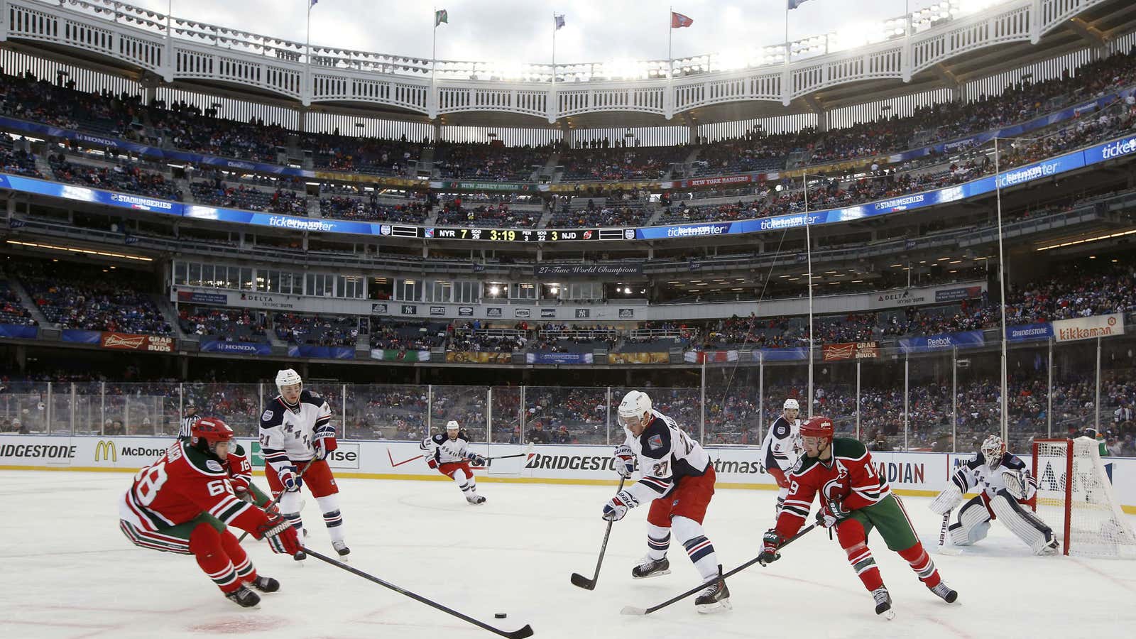 A 2014 NHL game between the New York Rangers and the New Jersey Devils, played at baseball’s famous Yankee Stadium.