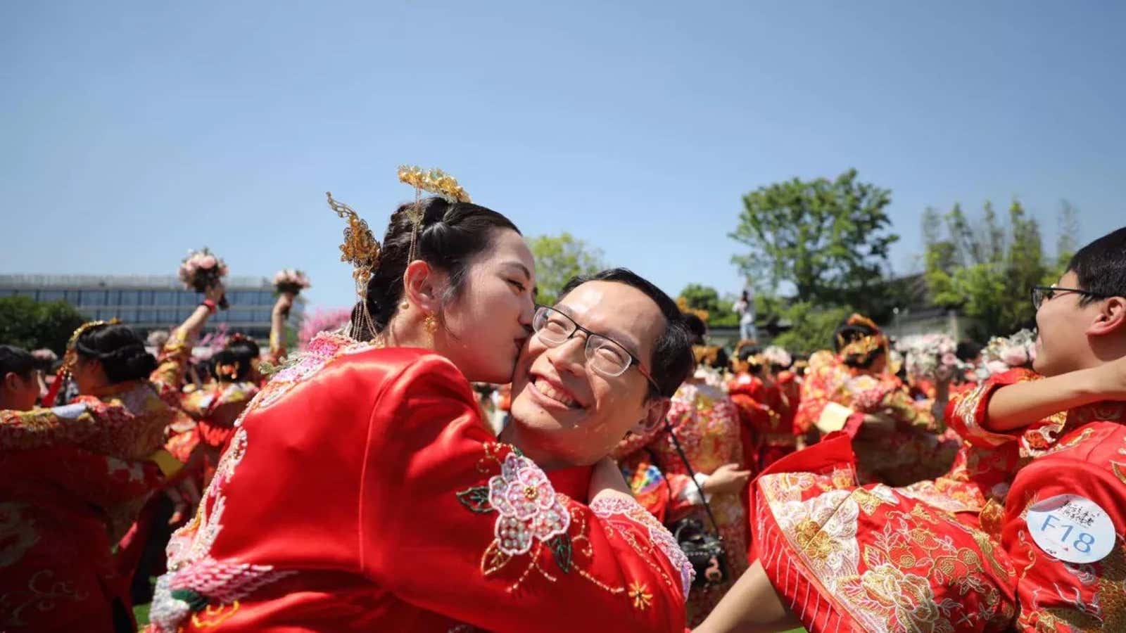 Bride and groom at a mass “wedding” on Alibaba Day.