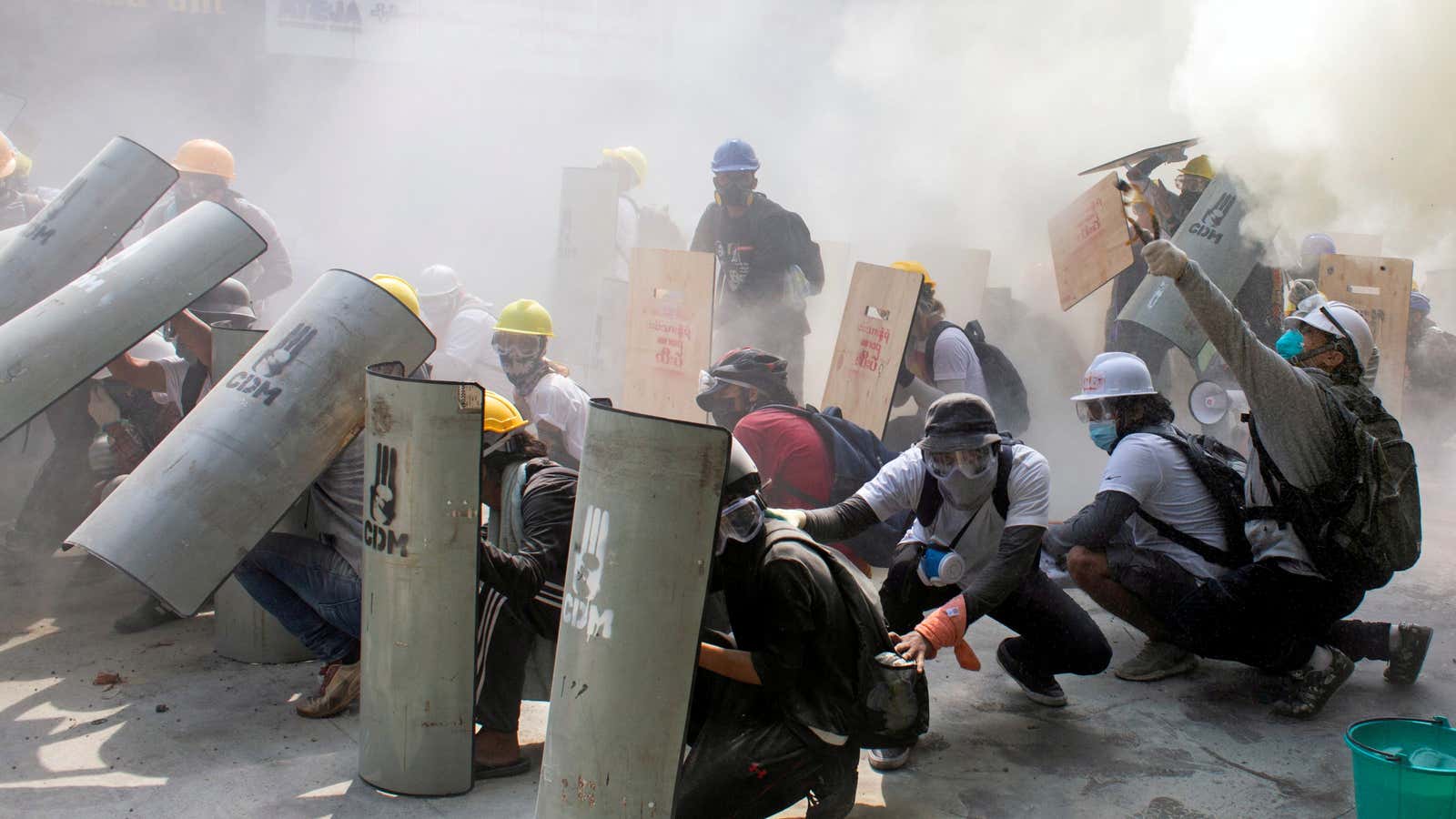 Protesters shield themselves in Myanmar.