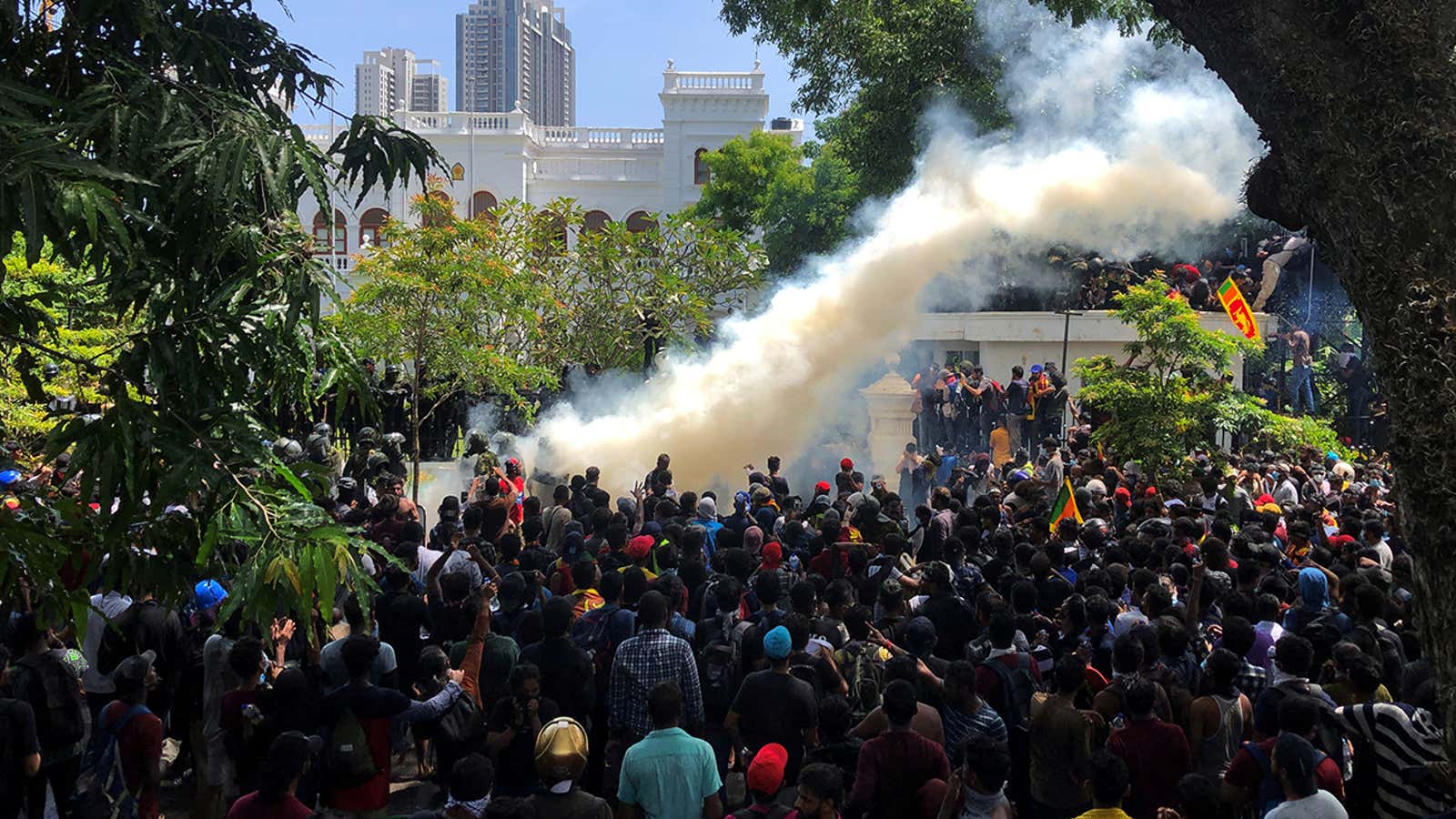 Demonstrators gather outside the office of Sri Lanka’s Prime Minister Ranil Wickremesinghe, amid the country’s economic crisis, in Colombo, Sri Lanka July 13, 2022. REUTERS/Adnan Abidi  REFILE -QUALITY REPEAT