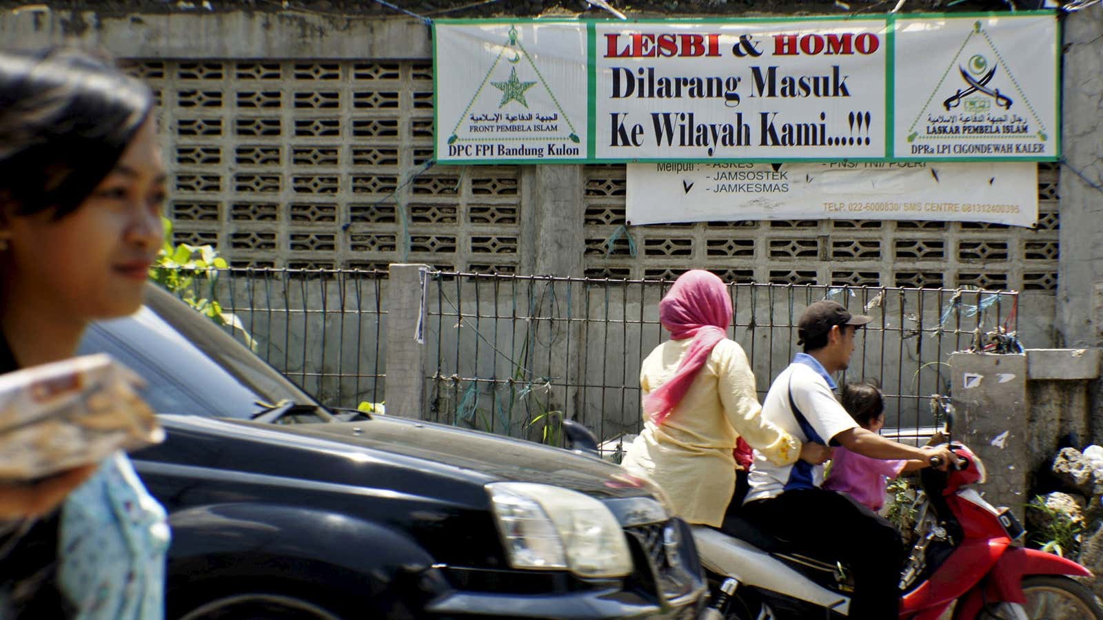 The banner reads, “Lesbians and gays may not enter our territory.”