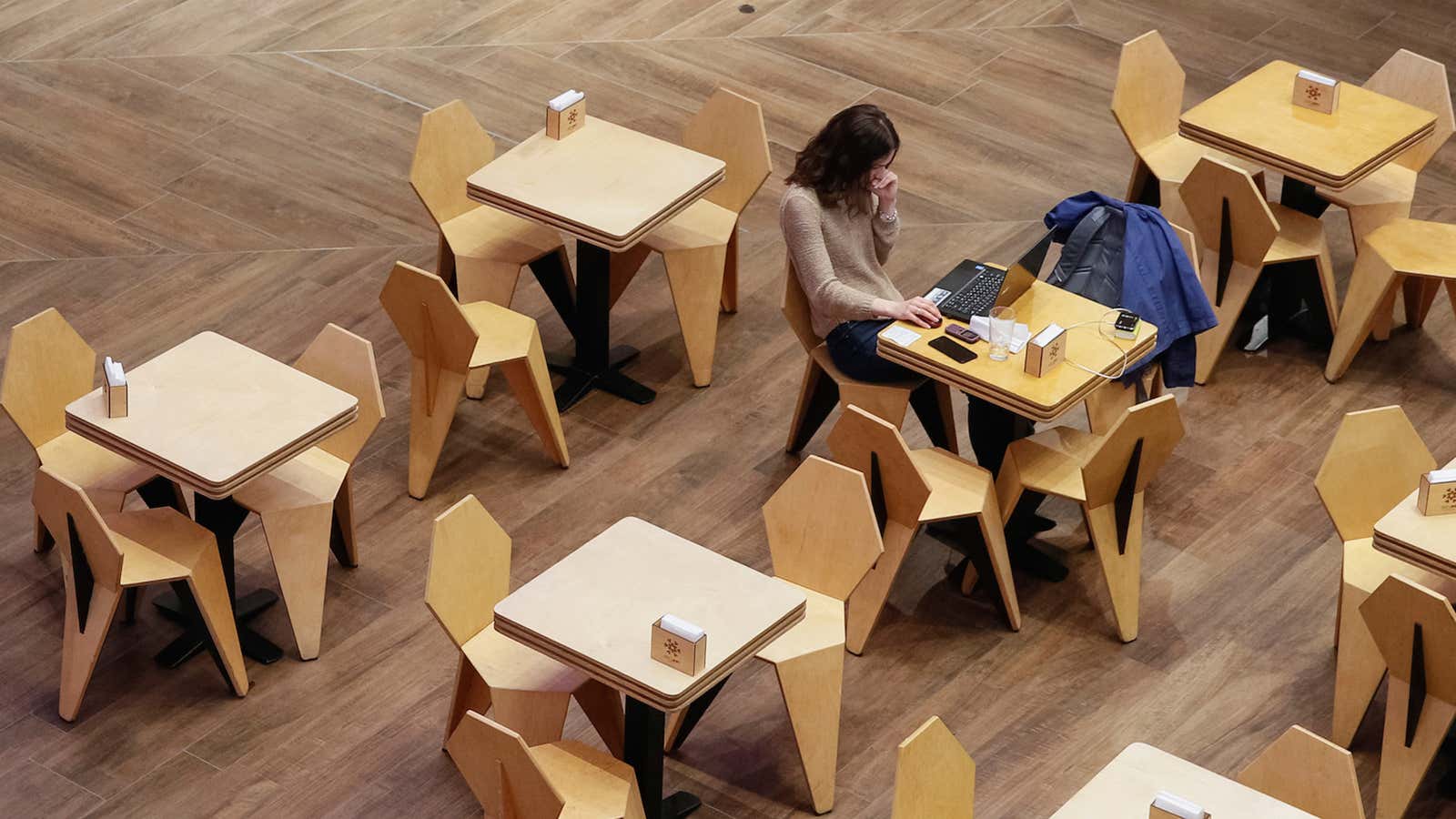 A woman uses a laptop at a cafe in the Central Universal Department Store (TsUM) in Kiev, Ukraine May 17, 2017. Picture taken May 17, 2017.