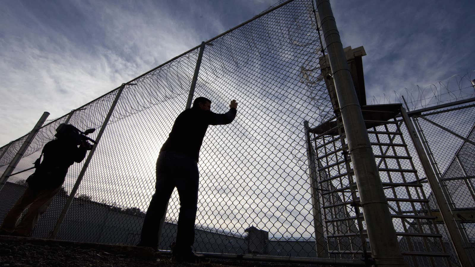 A view of gates to an exercise yard for inmates at Kingston Penitentiary in Kingston, Ontario October 11, 2013. British North America’s first penitentiary, the “Kingston Pen” as it is known, is now closed. Situated on prime real estate on the shore of Lake Ontario, its fate is unknown despite being designated as a National Historic Site. Public tours are currently being held to raise money for the United Way. The prison was once home to Canada’s most famous criminals including Canadian serial killers Clifford Olson and Paul Bernardo.    REUTERS/Fred Thornhill  (CANADA – Tags: CRIME LAW SOCIETY) – GM1E9AC0PR701