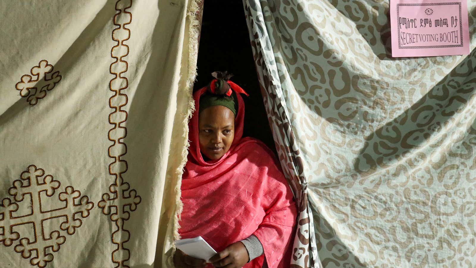 A housewife comes out of the secret voting booth after casting a vote, during the Sidama autonomy referendum in Hawassa, Ethiopia Nov. 20, 2019.