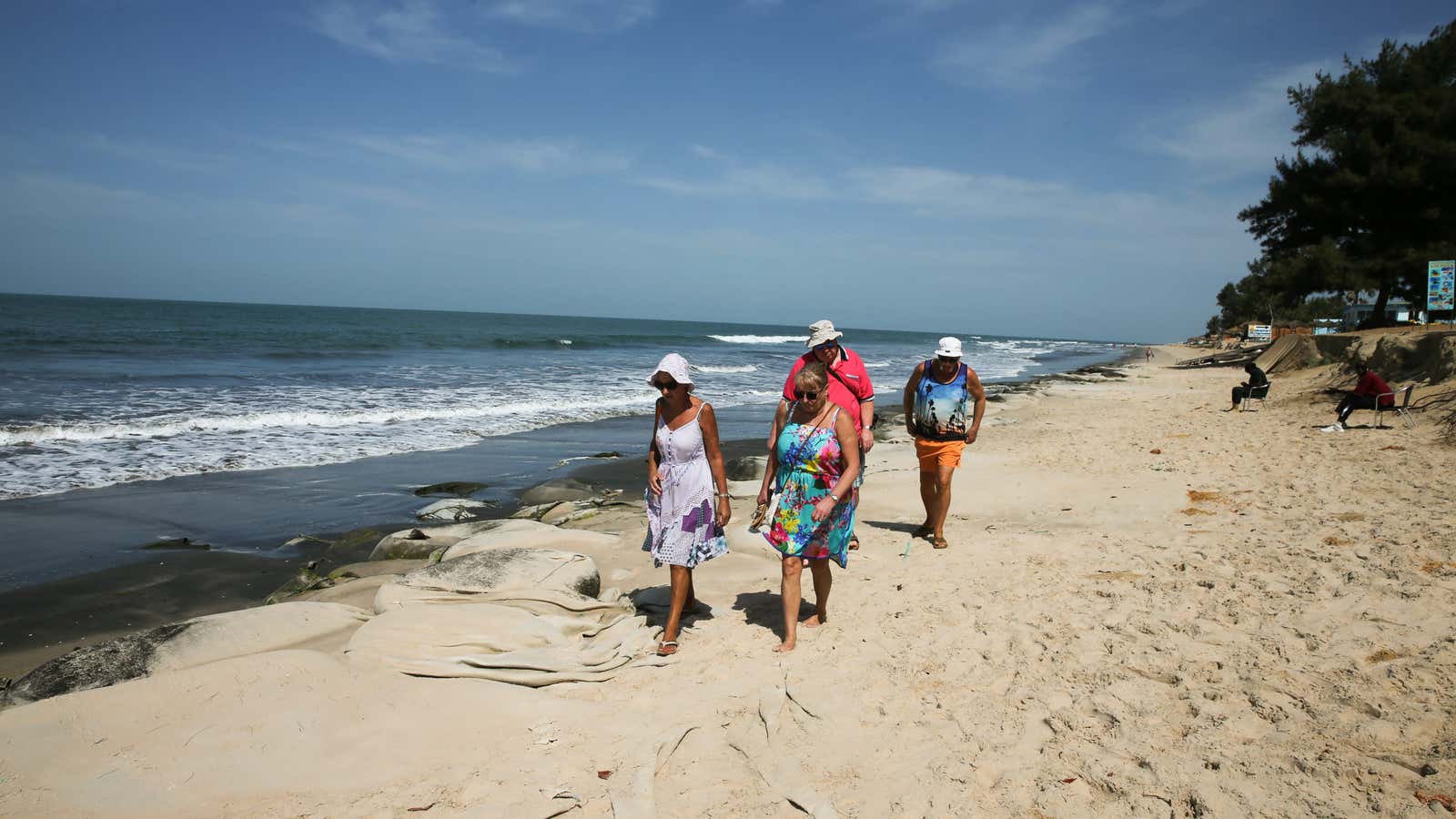 Tourists walk along the Senegambia beach in Gambia, January 19, 2017.