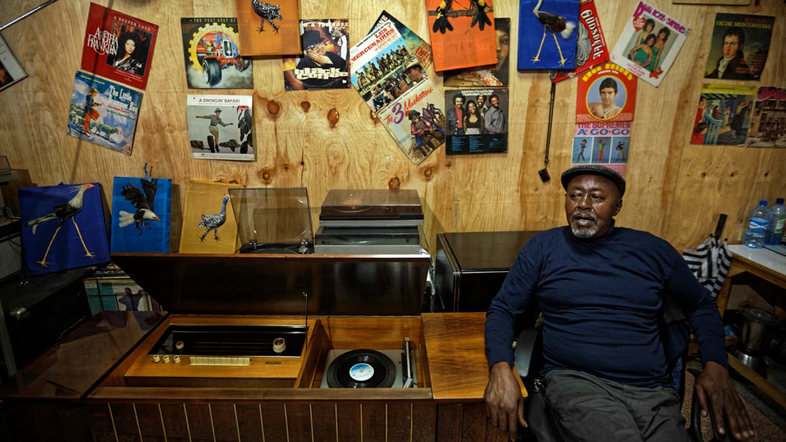 In this photo taken Thursday, March 1, 2018, James “Jimmy” Rugami recounts his story inside his vinyl records stall in Kenyatta Market in Nairobi, Kenya.…