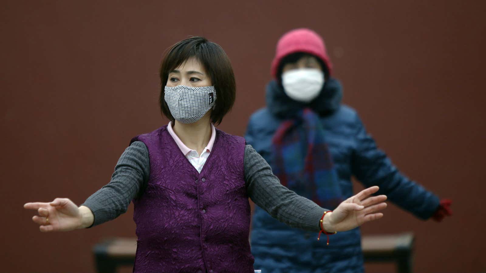 Women dance at a Beijing park despite warnings from health authorities to stay inside.