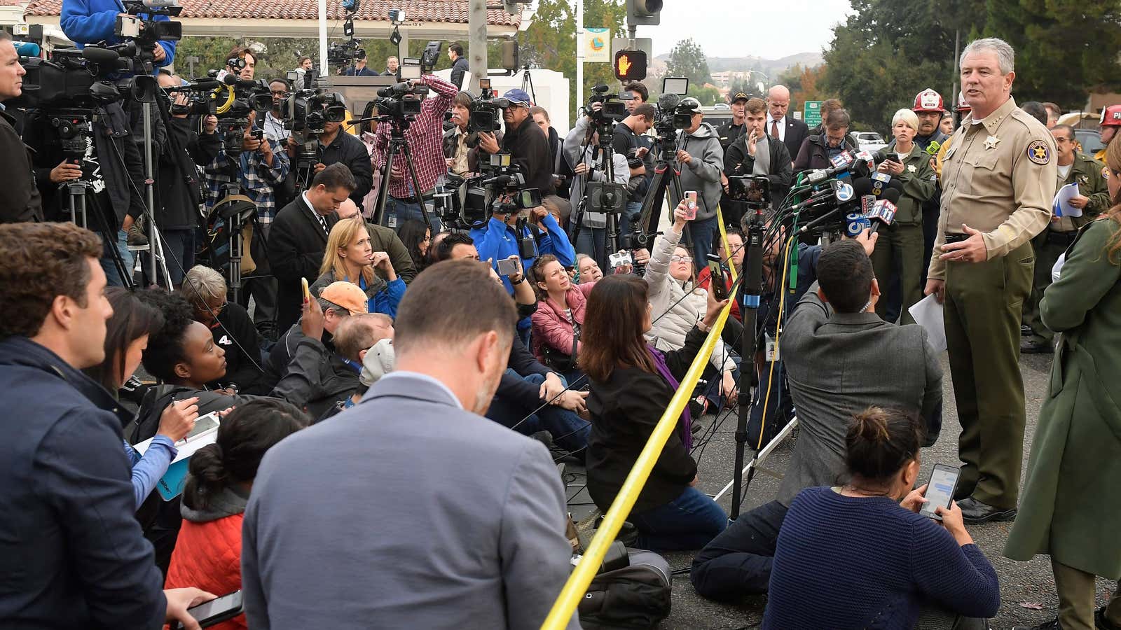 Reporters on the job in Thousand Oaks, California.