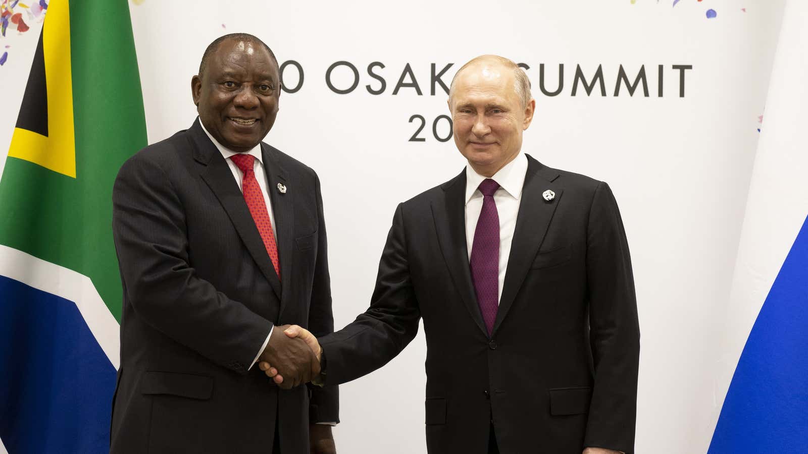 Russian president Vladimir Putin, right, and South African president Cyril Ramaphosa shake hands during their meeting on the sidelines of the G-20 summit in Osaka, western Japan, Friday, June 28, 2019.