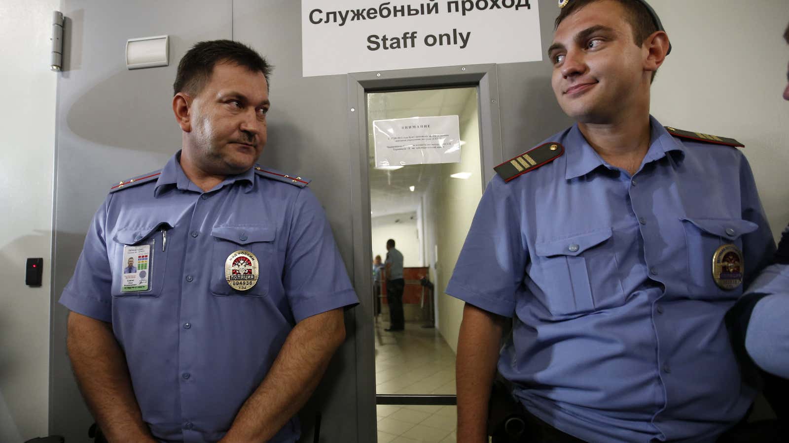 Russian police guarded Snowden’s airport meeting.