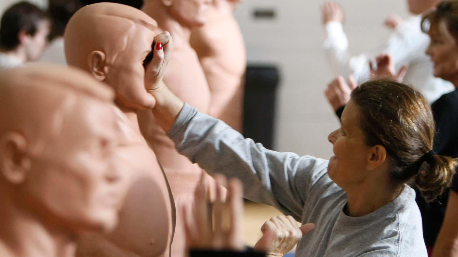 A Frontier Airlines flight attendant practices during a crew member self-defense course.