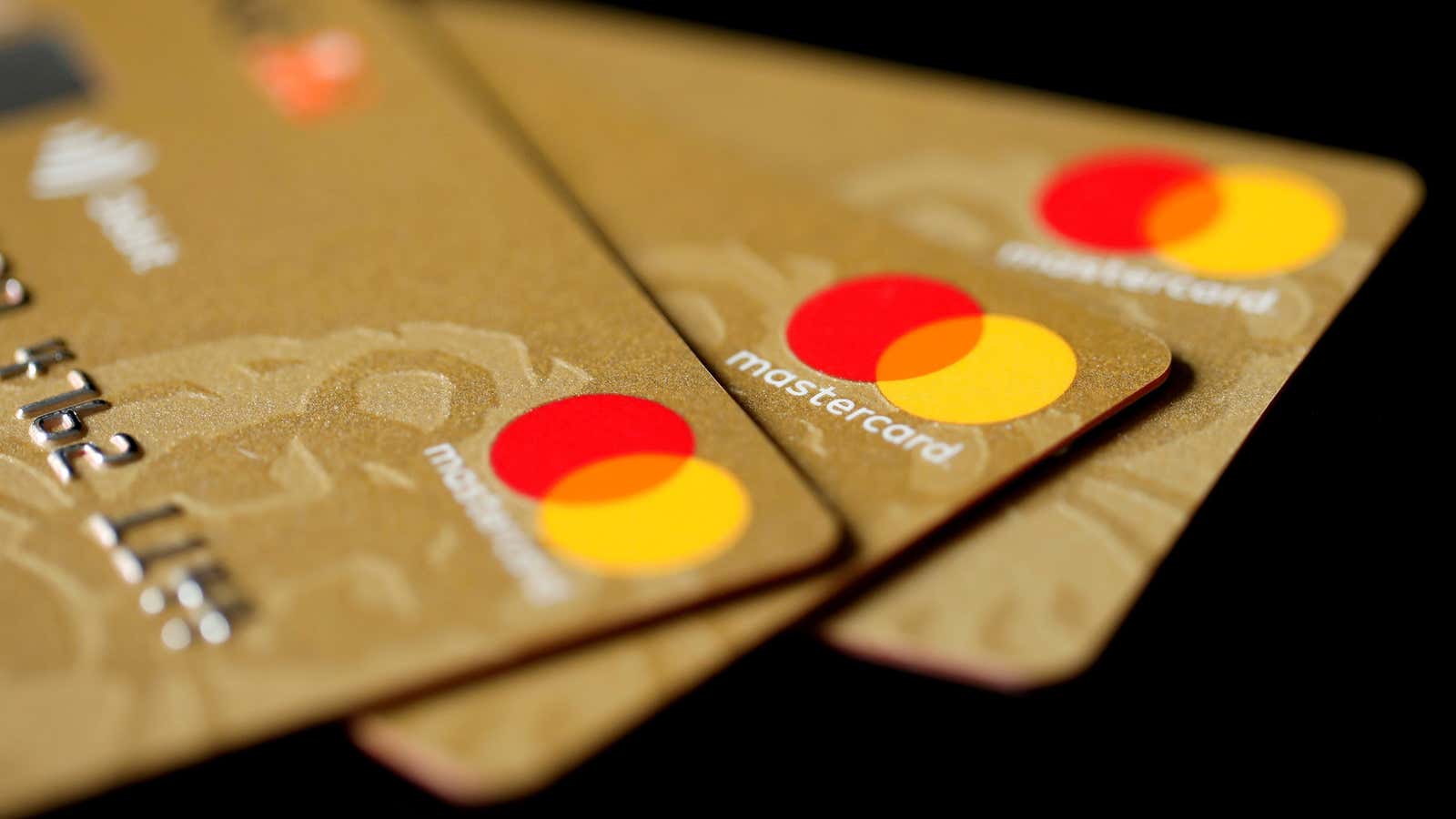 FILE PHOTO: Mastercard Inc. credit cards are displayed in this picture illustration taken December 8, 2017. REUTERS/Benoit Tessier/Illustration/File Photo