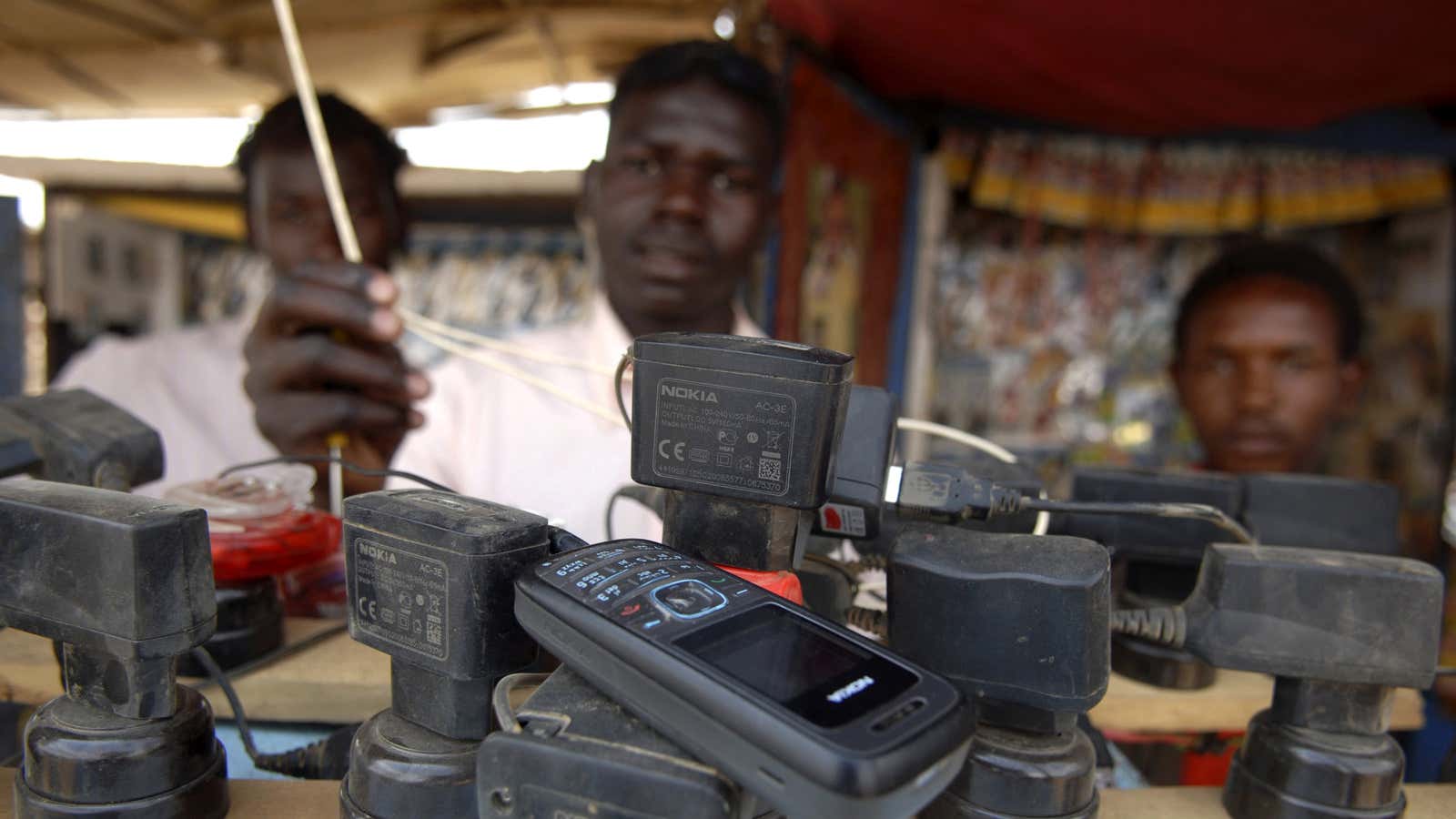 The way to his wallet is through his clunky old phone.