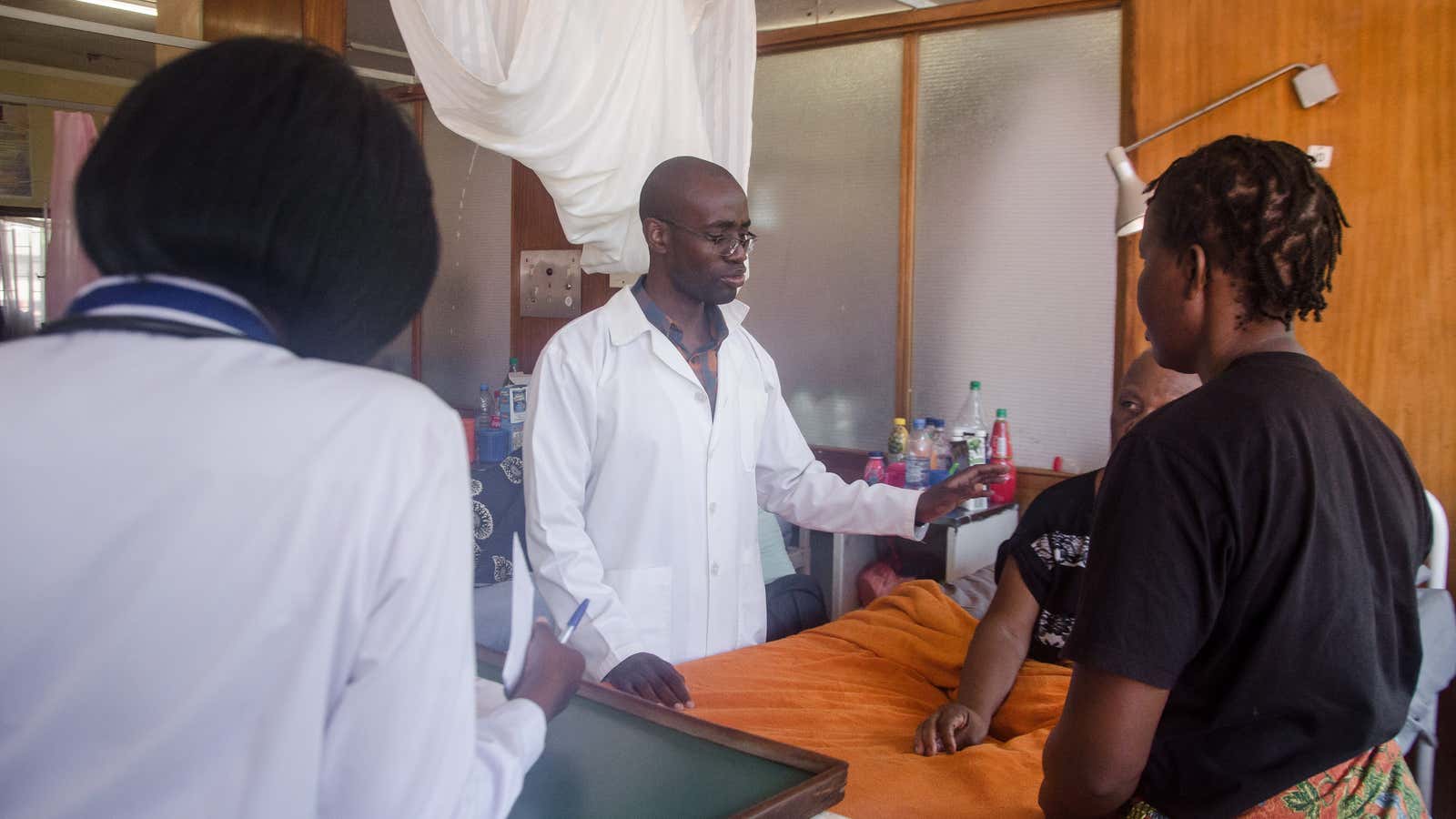 Stanley Zimba examines a patient.