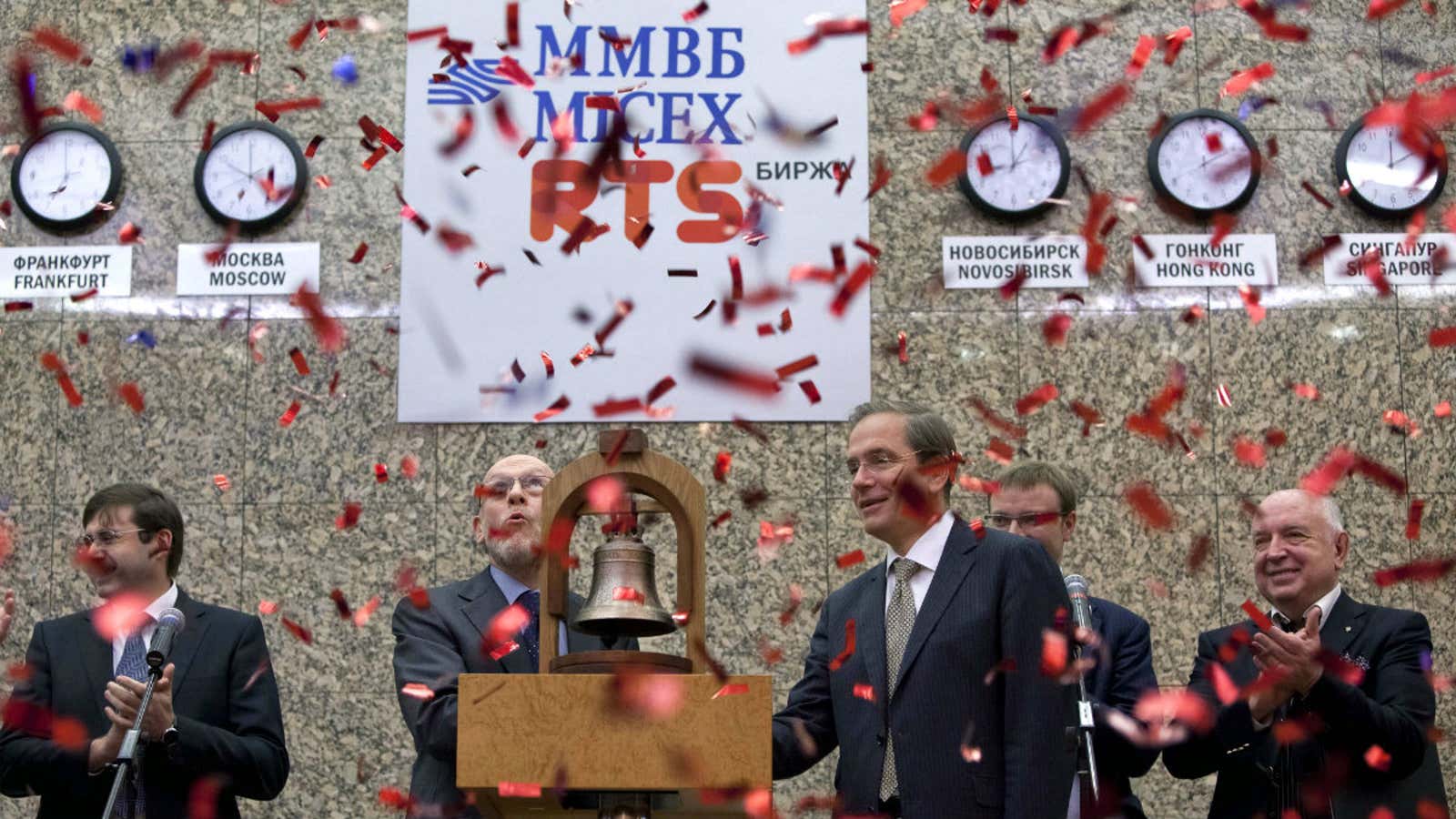 Officials ring in the 2011 opening of Russia’s joint stock exchange.