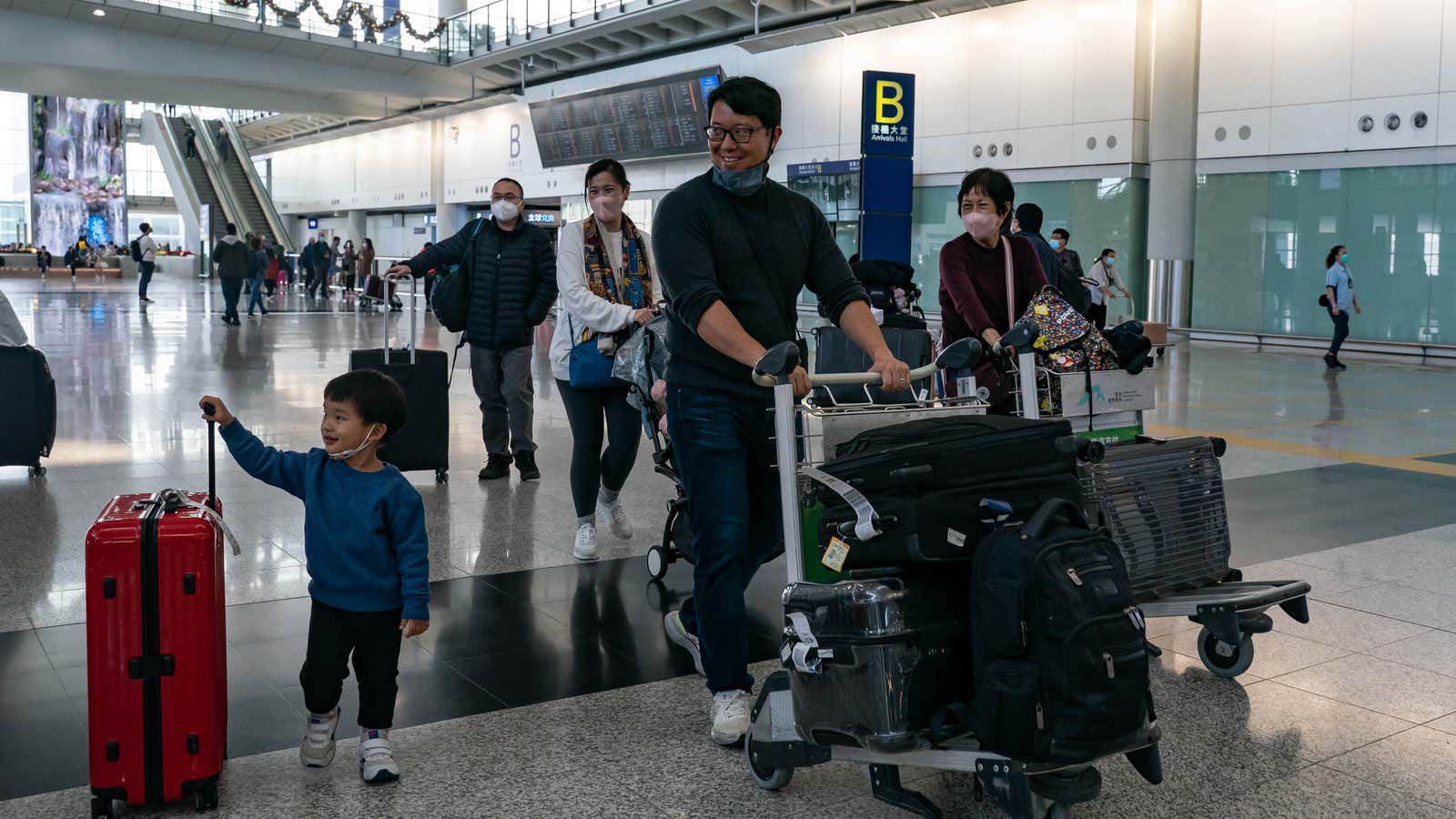 Travelers take advantage of newly-loosened restrictions at the Hong Kong international airport.