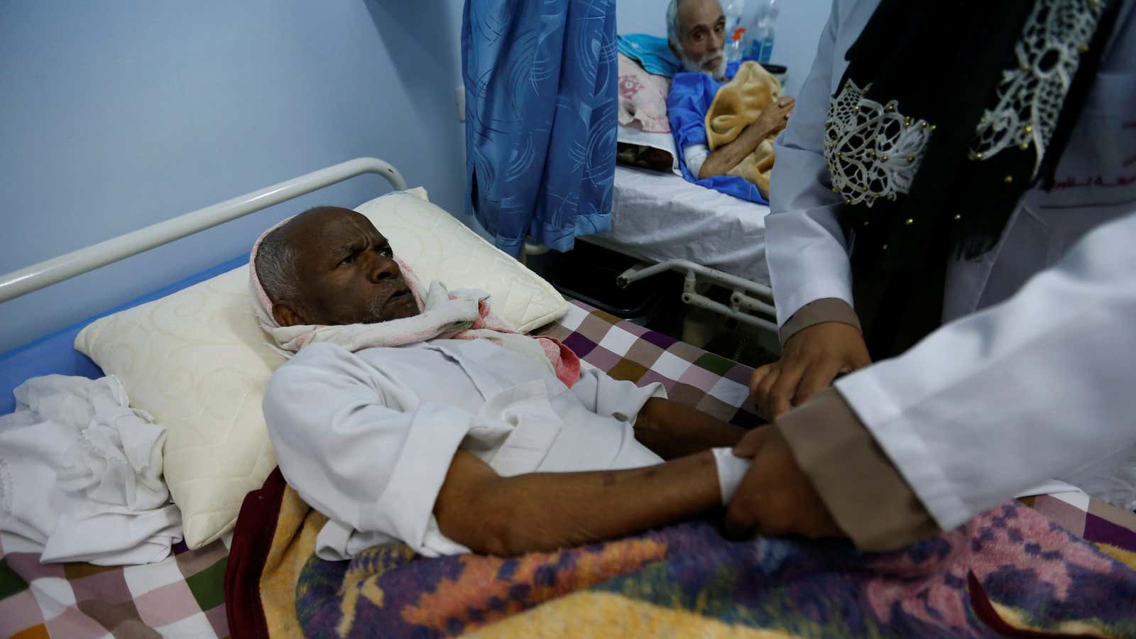 A nurse injects a patient at the Misurata Cancer Center in Misurata, Libya