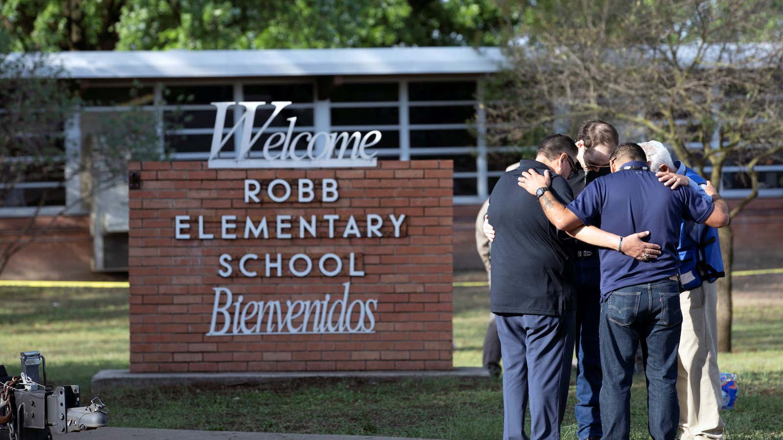 People gather at Robb Elementary School, the scene of a mass shooting in Uvalde, Texas, U.S. May 25, 2022.