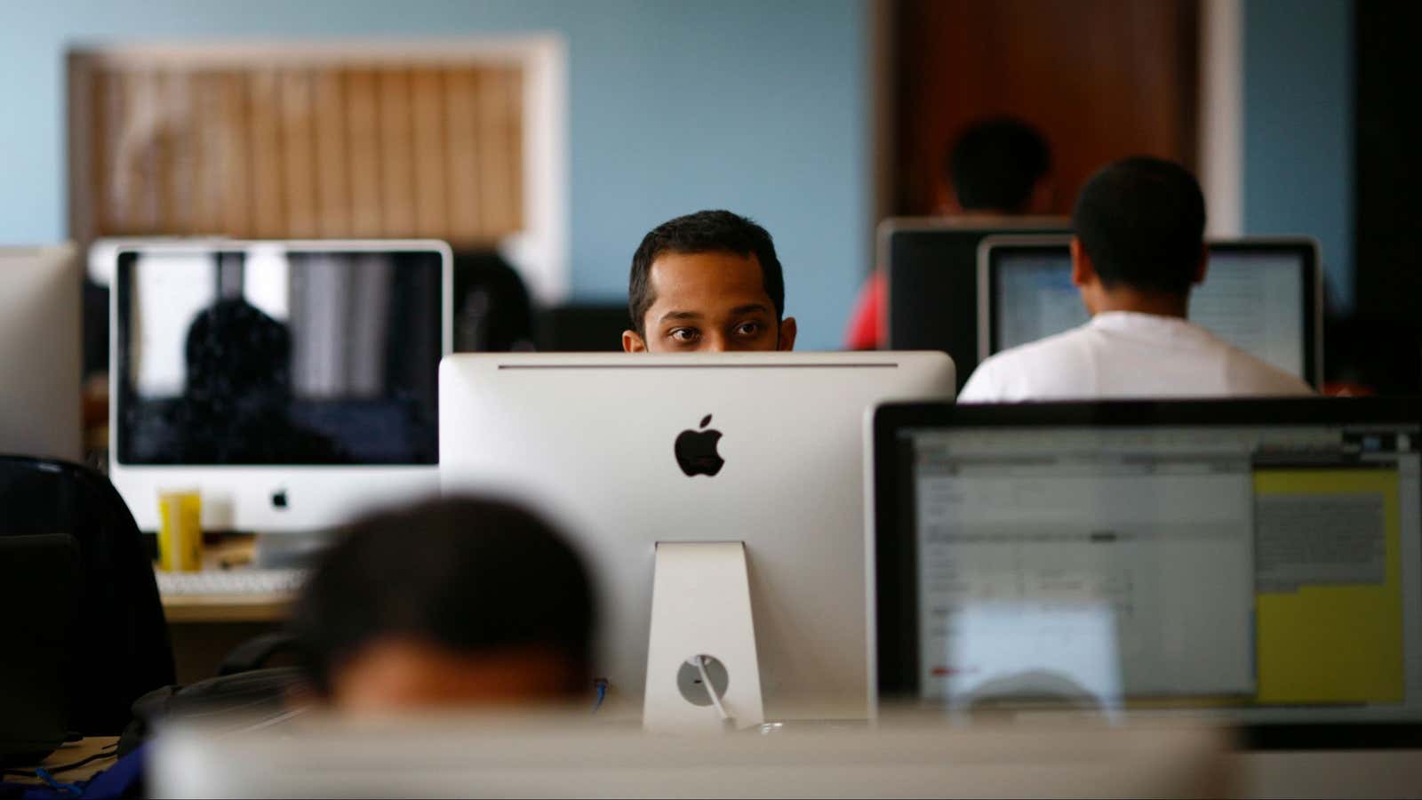 An employee works on his computer at the office of CloudFactory, a Canadian startup that based itself in Kathmandu, where it hires teams of Nepalese…