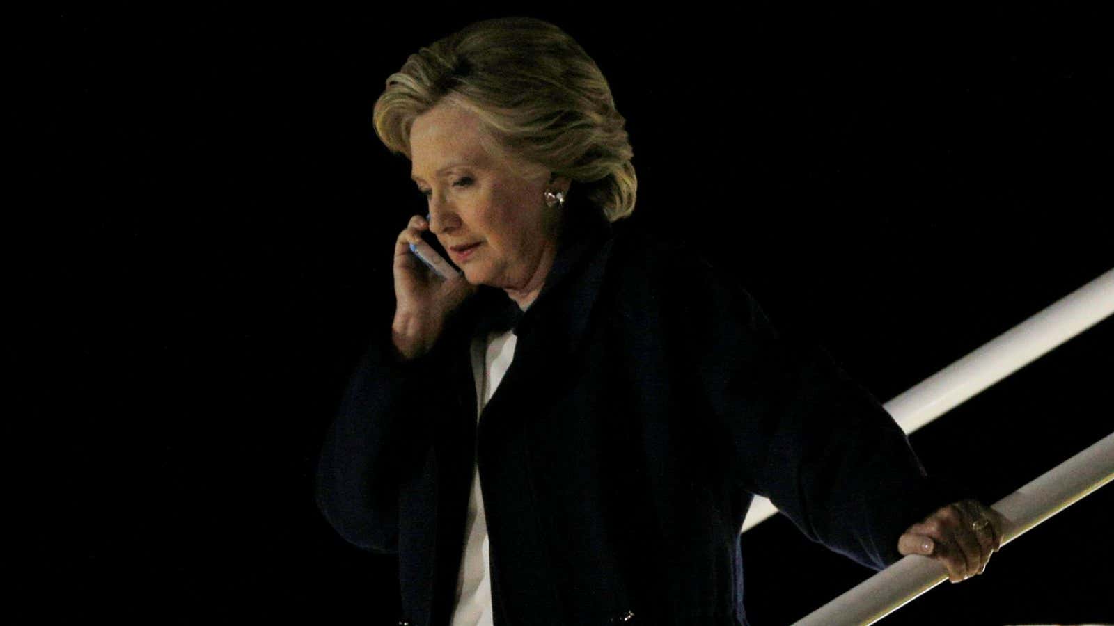 U.S. Democratic presidential nominee Hillary Clinton talks on her mobile phone as she gets off her campaign plane in Cleveland, Ohio, U.S. November 4, 2016.…