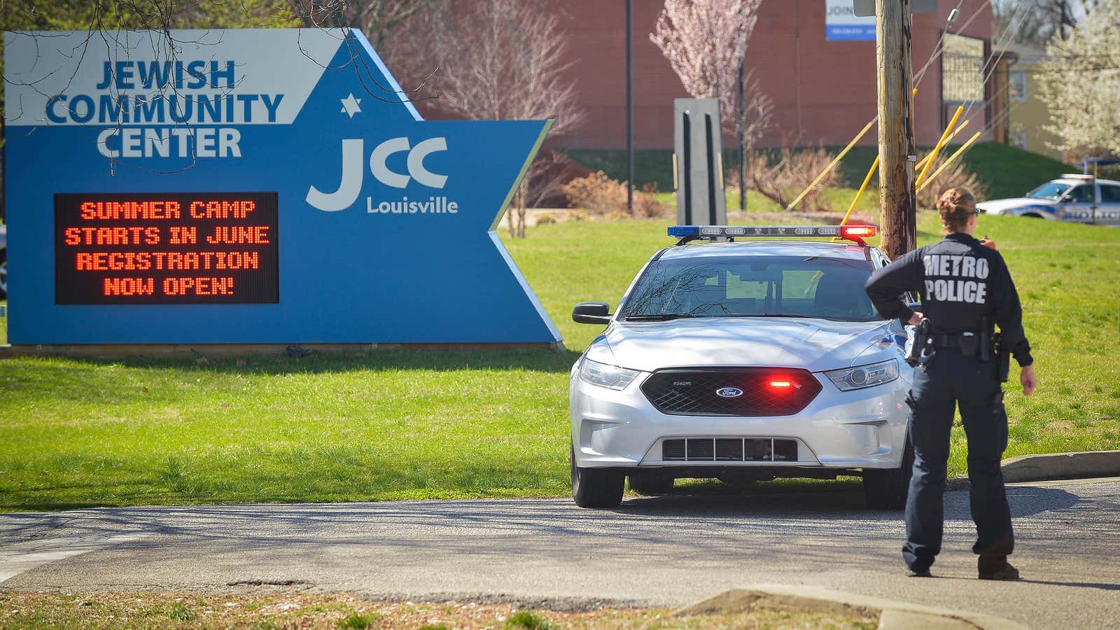 Police officers respond to a bomb threat against a Jewish Community Center in Louisville, Kentucky, in March 2017.