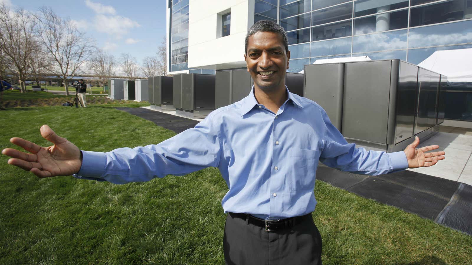 Voila! KR Sridhar, co-founder and CEO of Bloom Energy, poses in front of the company’s power servers at  eBay’s California building in 2010.