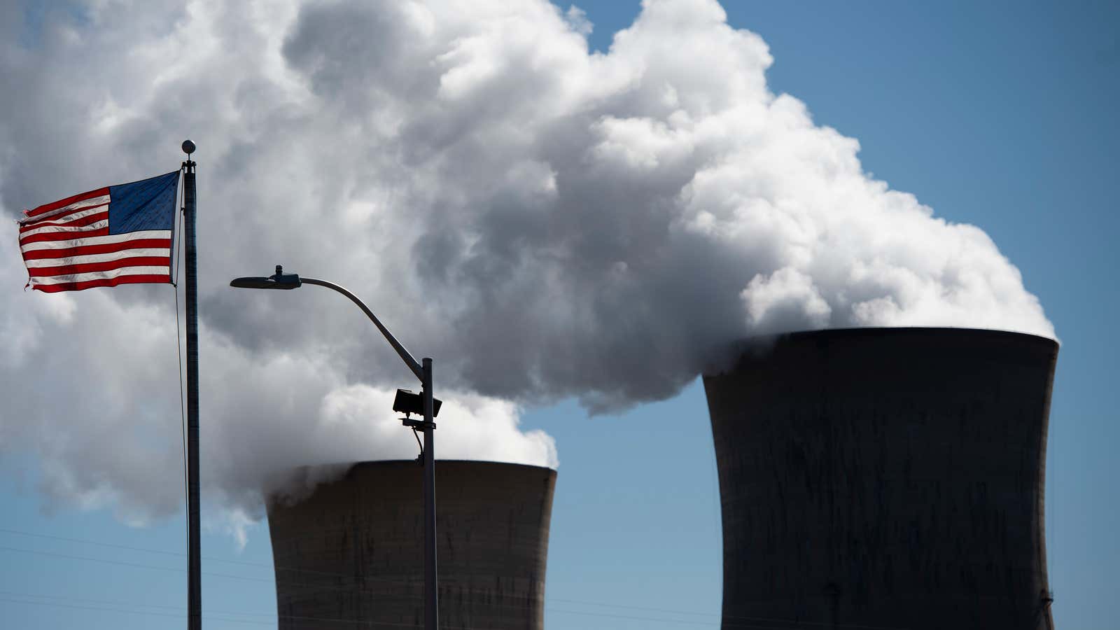 Steam rises out of the nuclear plant on Three Mile Island, with the operational plant run by Exelon Generation, in Middletown, Pennsylvania on March 26, 2019.